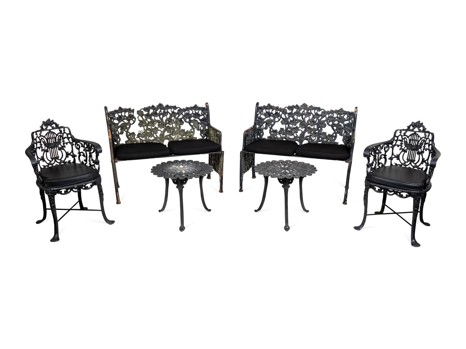 A Suite of Black Painted Metal Garden Furniture