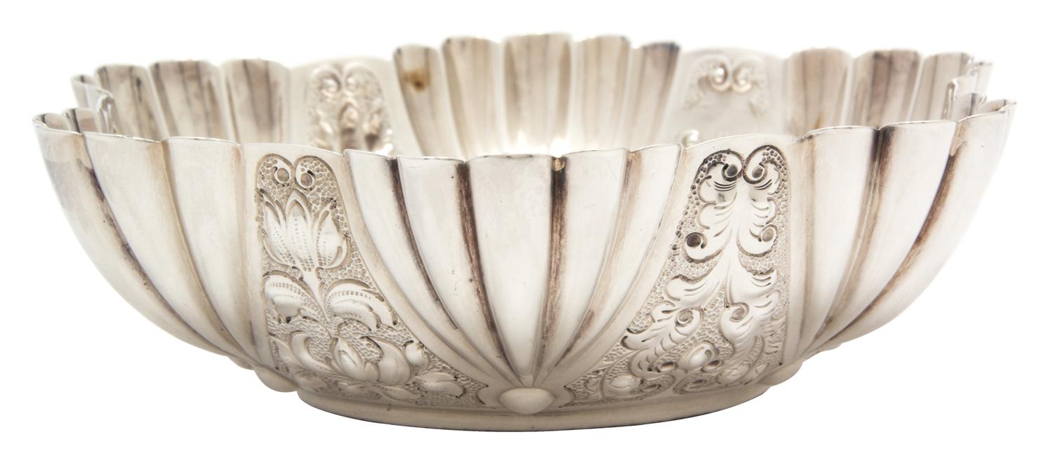A Victorian Silver Bowl, Atkin Brothers, London, 1889, with fluted sides chased with foliate scrolls.