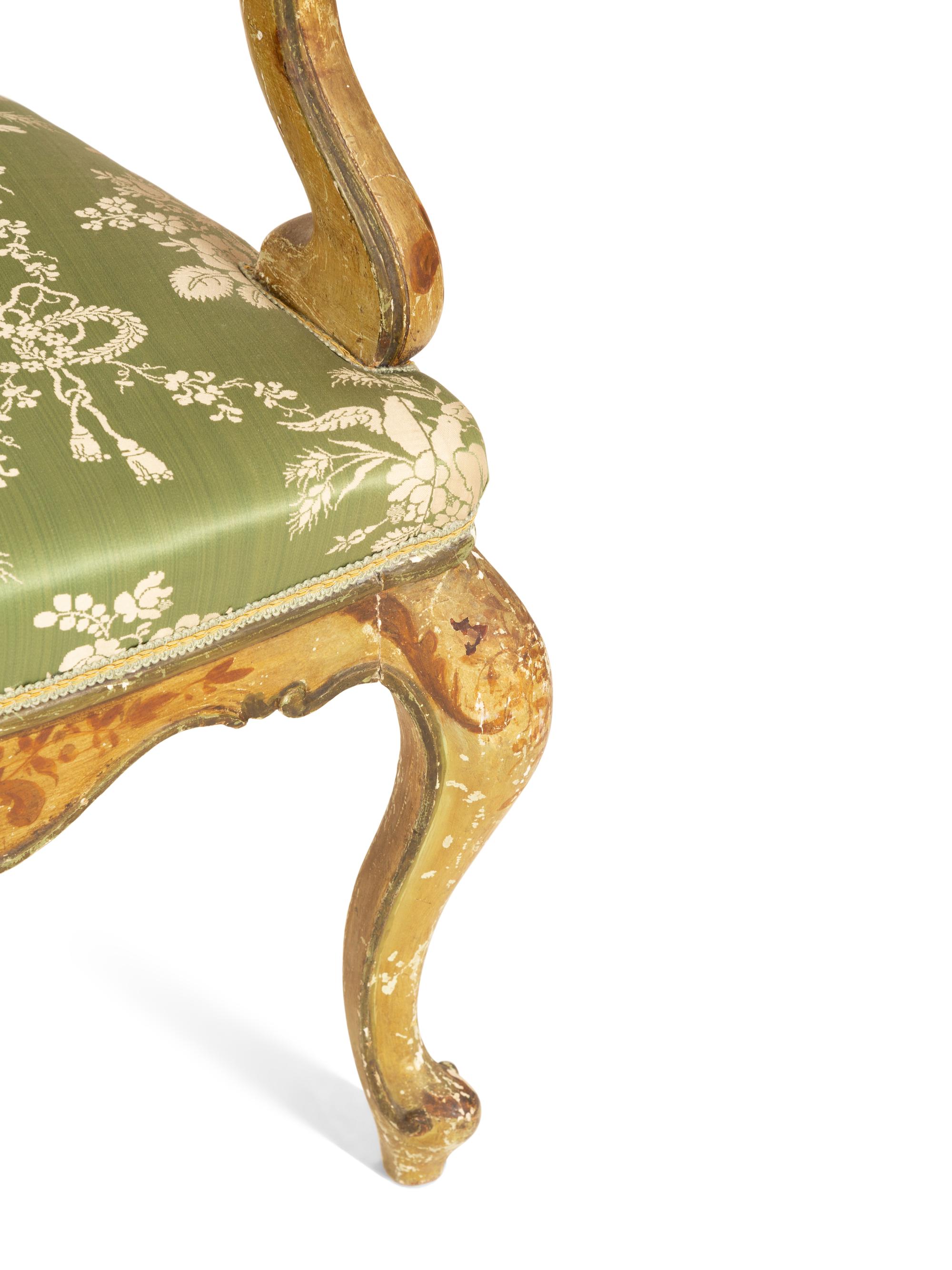A Pair of Italian Painted and Parcel Gilt Open Armchairs