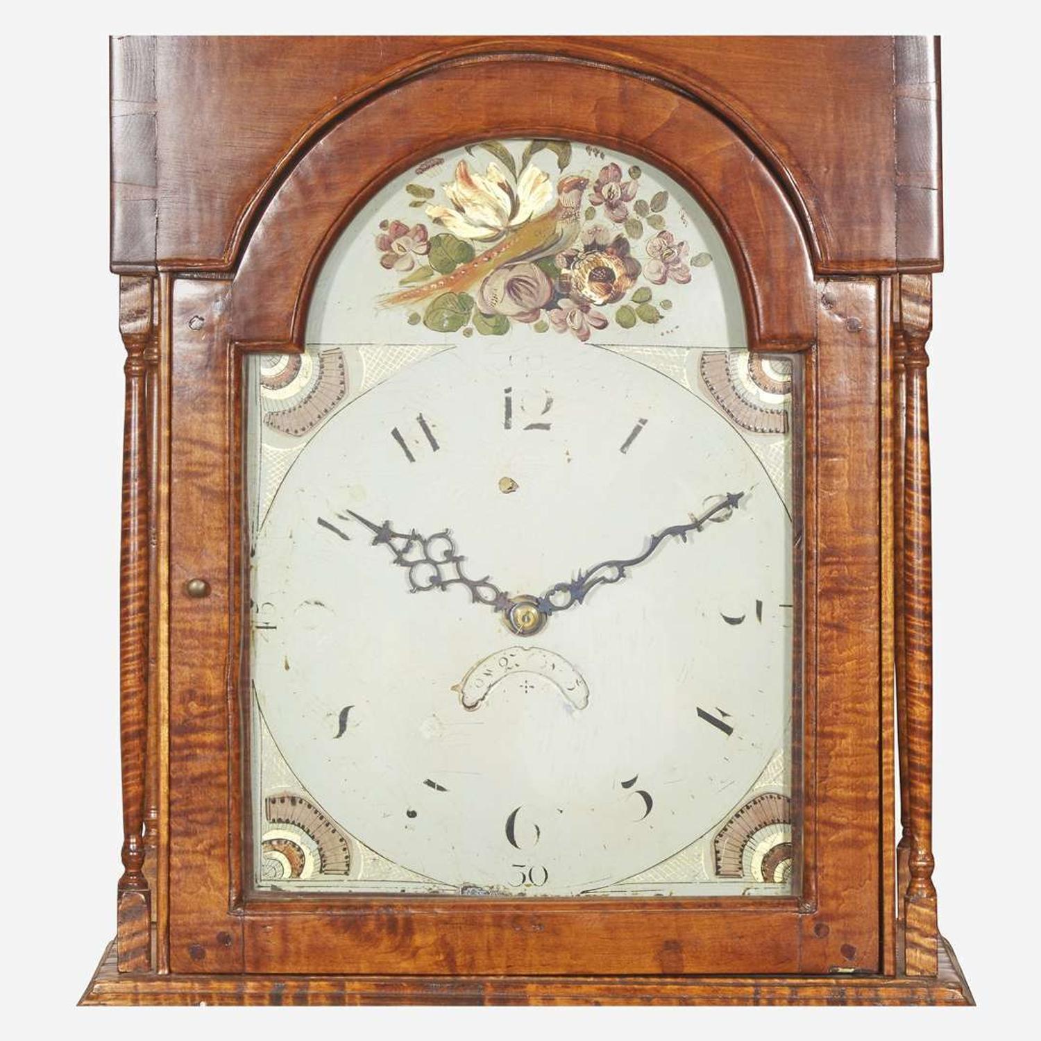 A Chippendale carved tiger maple tall case clock The face / works early 19th century, the case 20th century