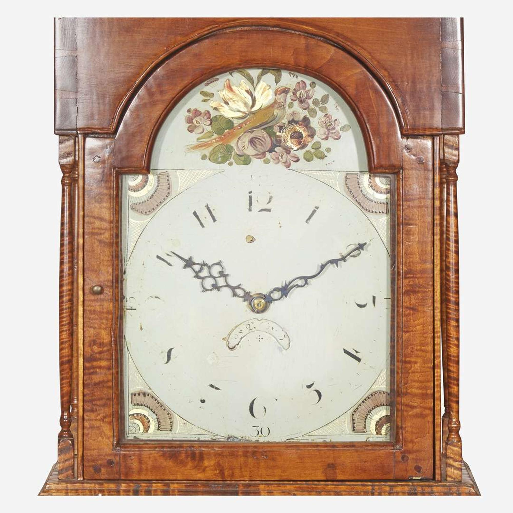 A Chippendale carved tiger maple tall case clock The face / works early 19th century, the case 20th century