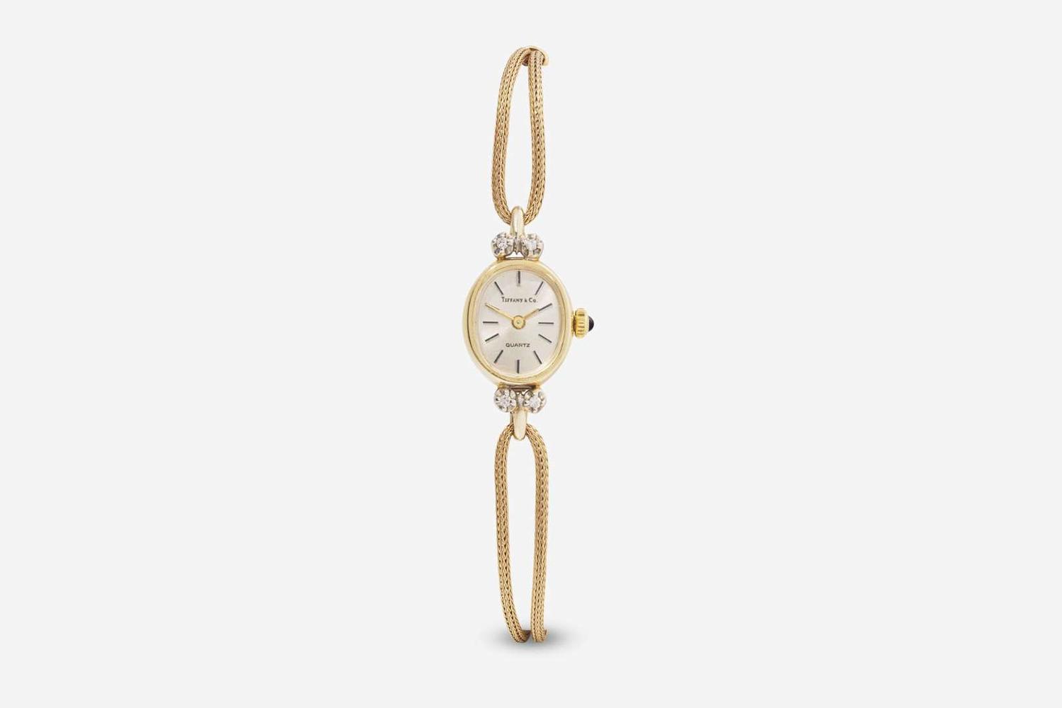 A Ladies 14K Yellow Gold and Diamond Watch by Tiffany & Co.