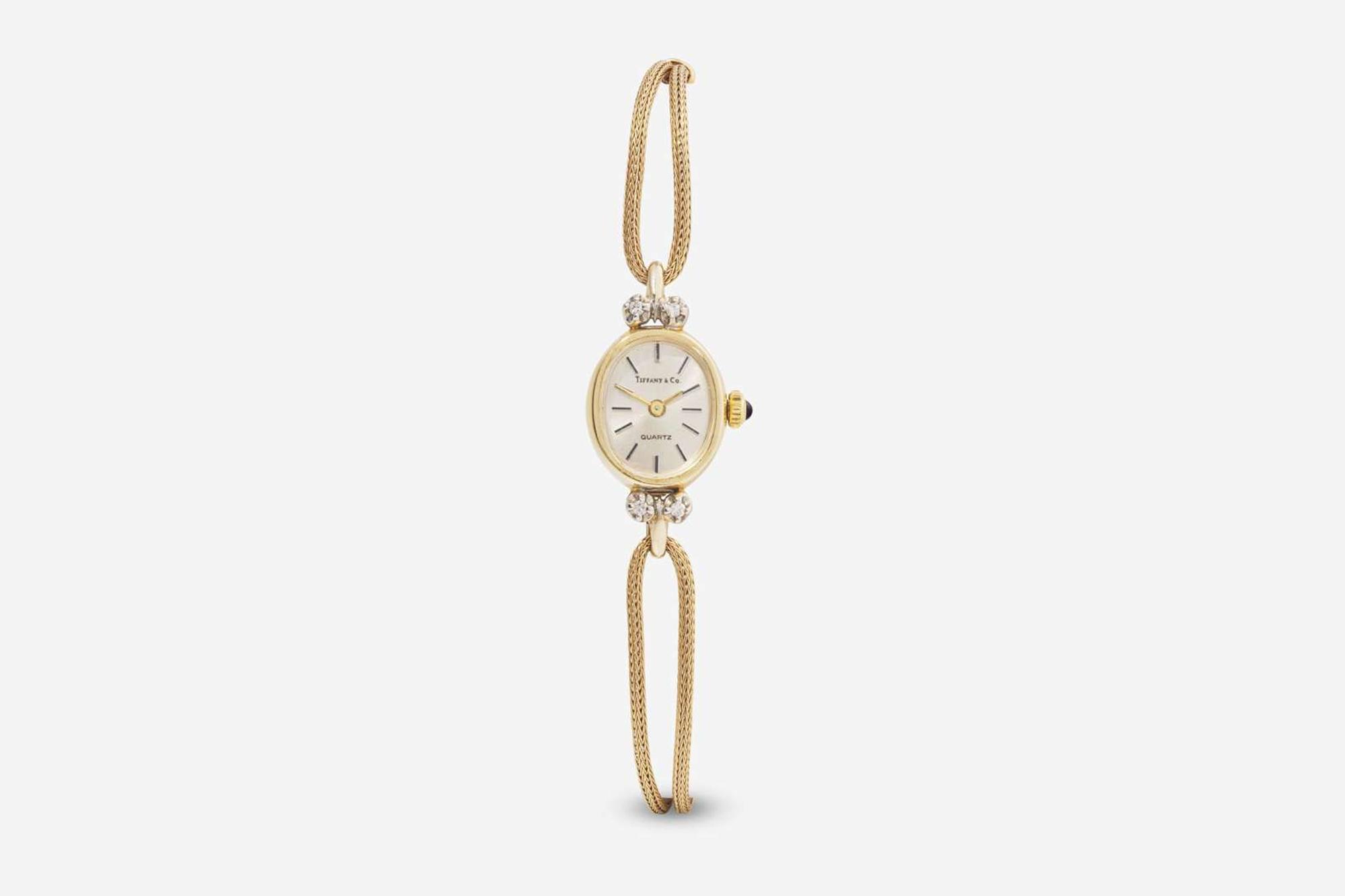 A Ladies 14K Yellow Gold and Diamond Watch by Tiffany & Co.