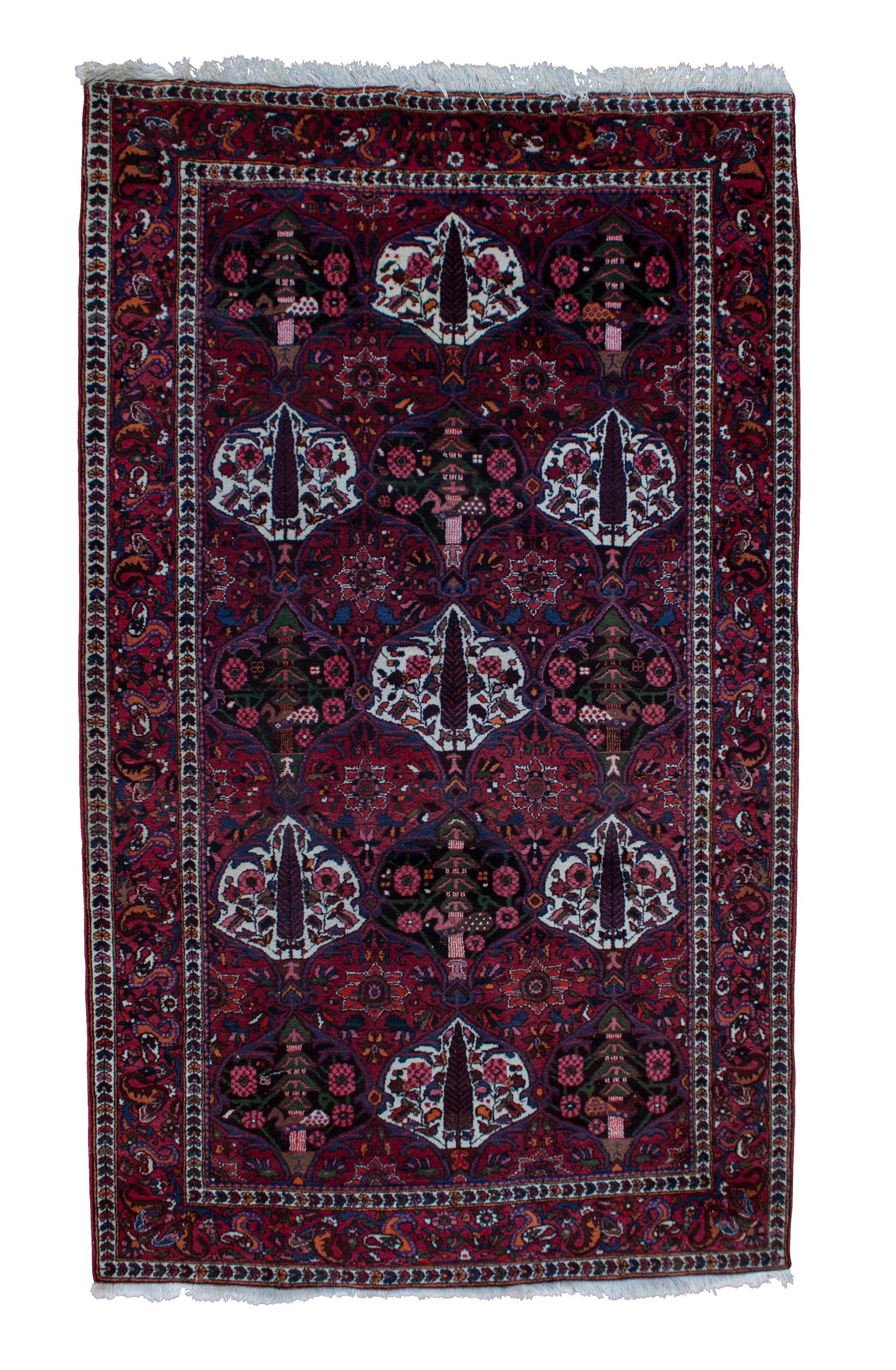 A Kerman Wool Rug 9 feet x 5 feet 6 inches.