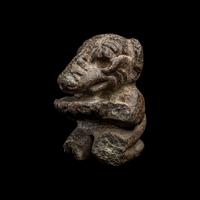 An Olmec Serpentine Kneeling Transformation Figure