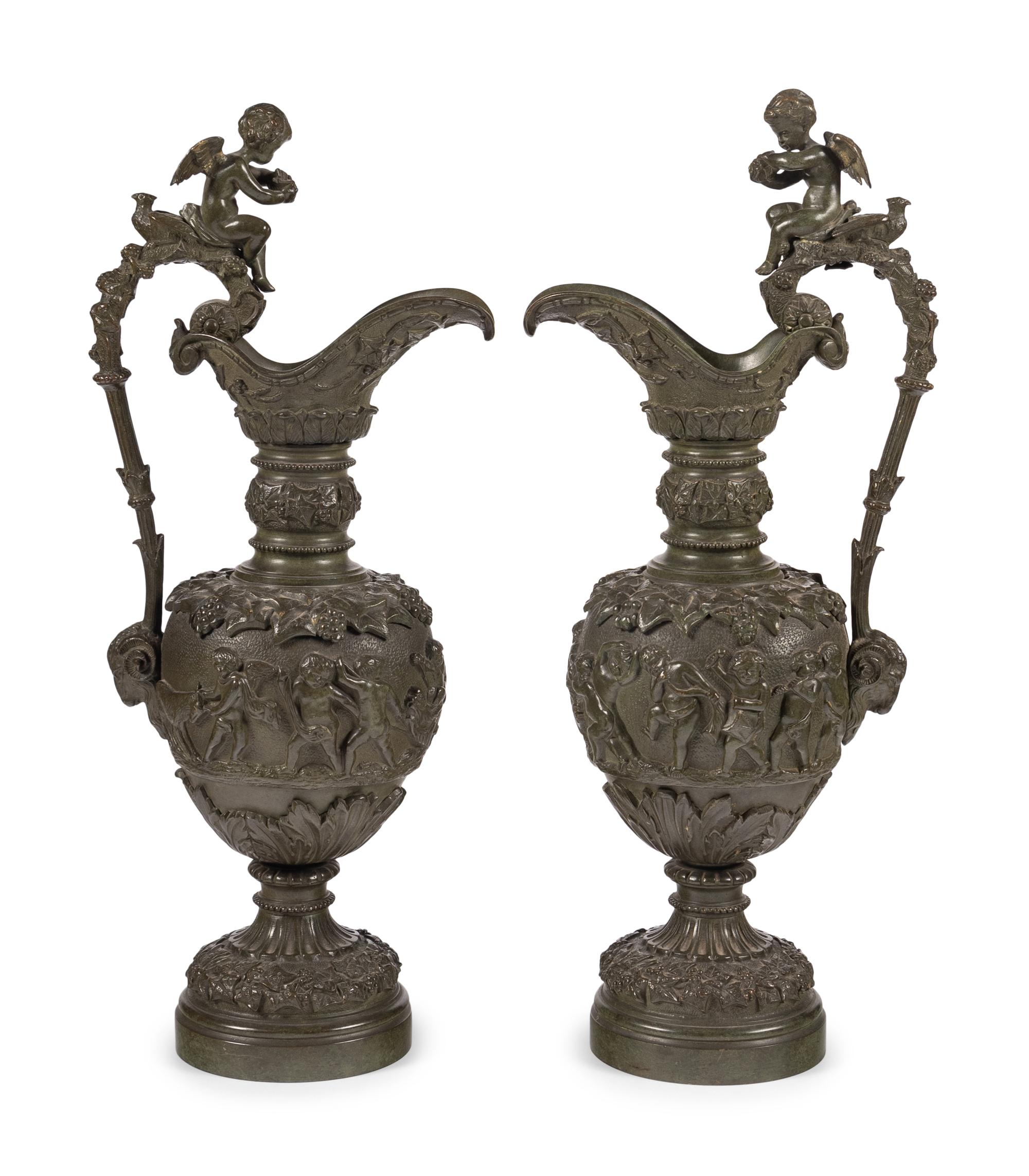 A Pair of Neoclassical Patinated Bronze Ewers with Bacchic Putti