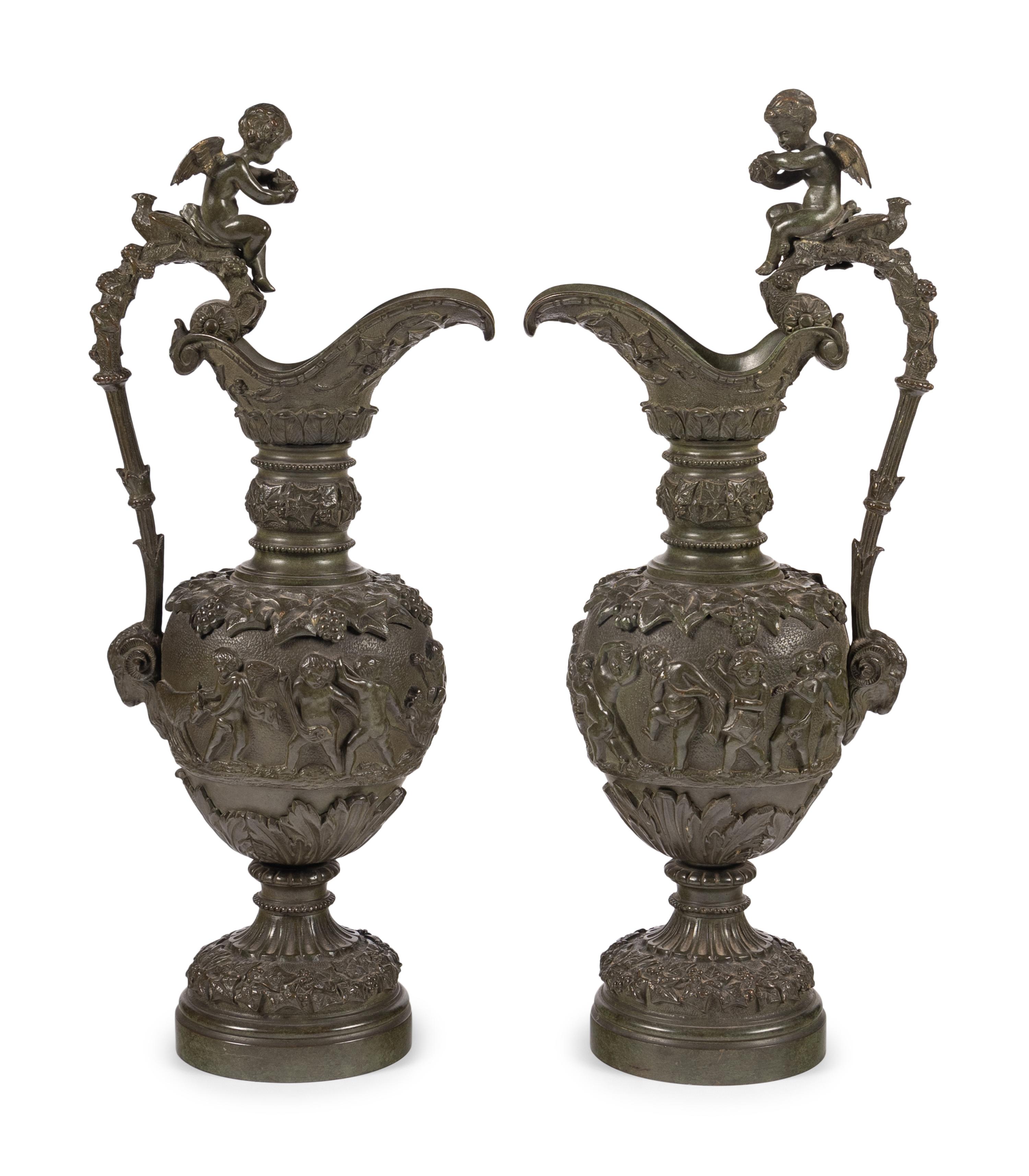 A Pair of Neoclassical Patinated Bronze Ewers with Bacchic Putti