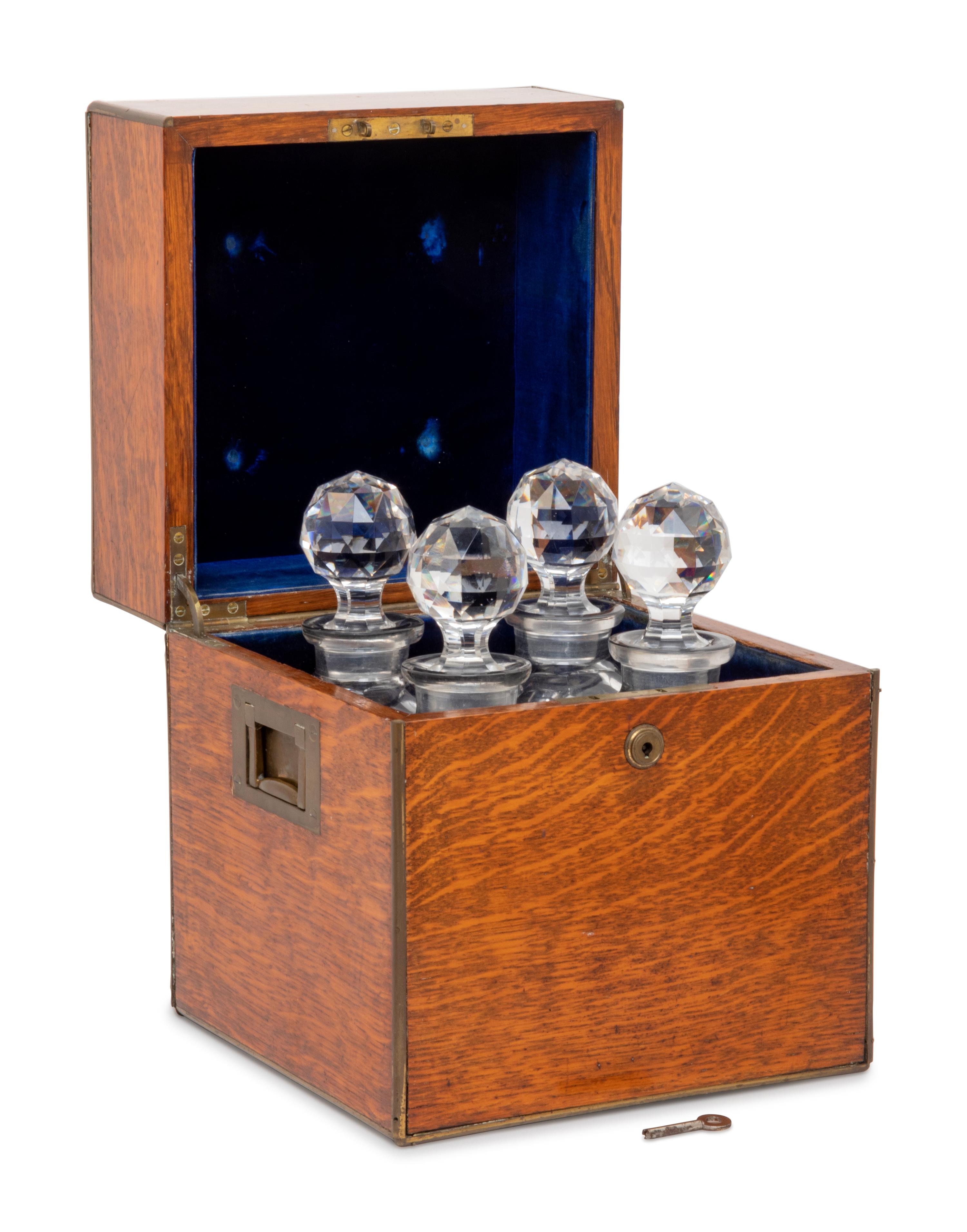 An English Oak Cased Cut Glass Decanter Set