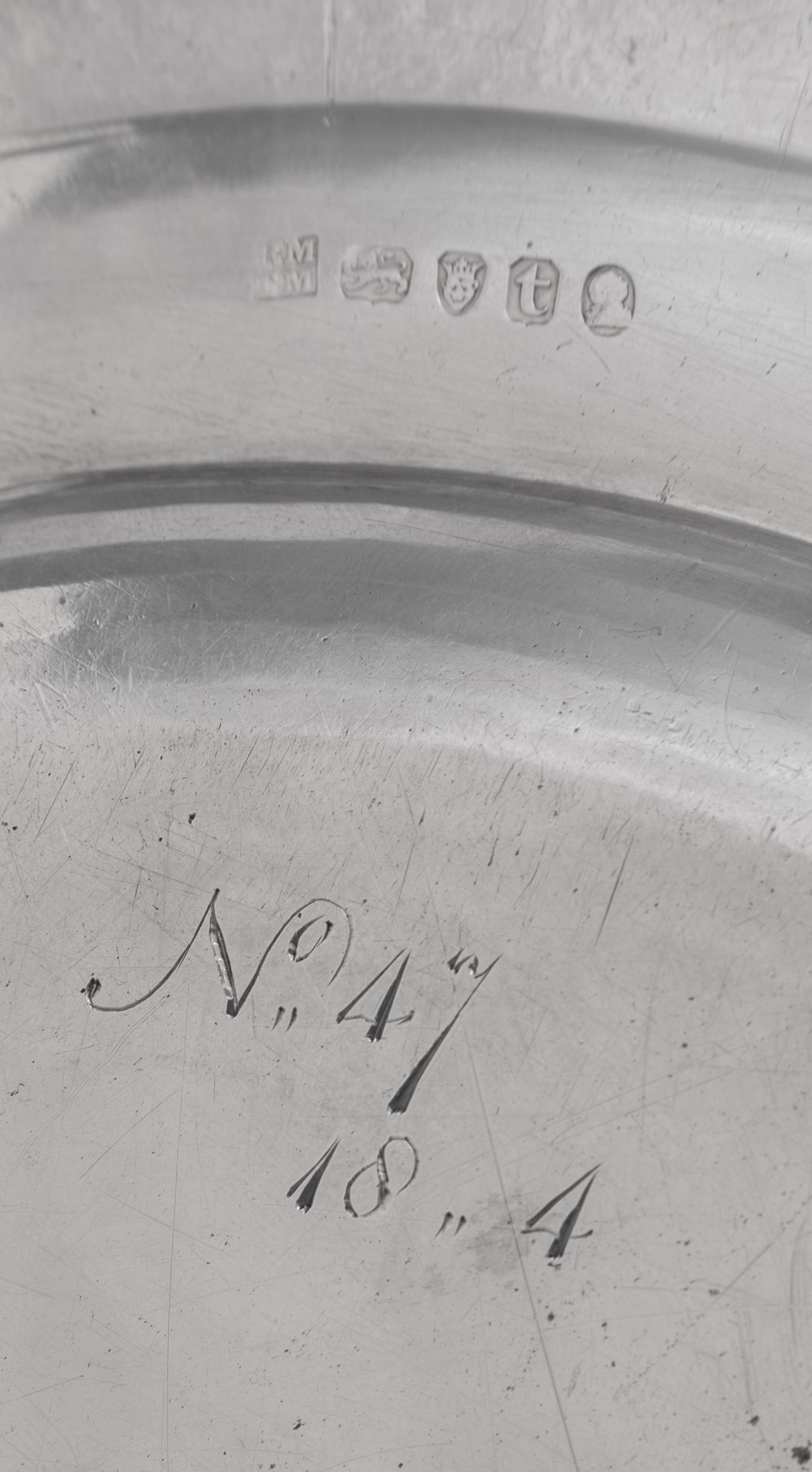 A Set of Eighteen George III Silver Plates