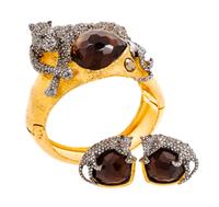 An Alexis Bittar Jaguar Cuff and Matching Earclips, Cuff size: 6.5"; Width: 2"; Earclips: 1" diameter.