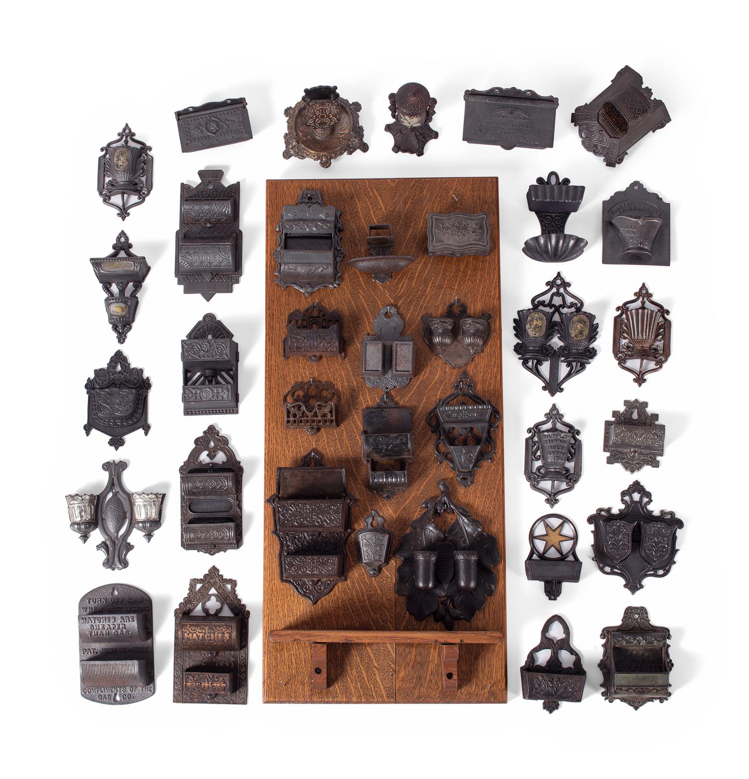 A Group of Cast Iron Hanging Match Holders
