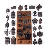A Group of Cast Iron Hanging Match Holders