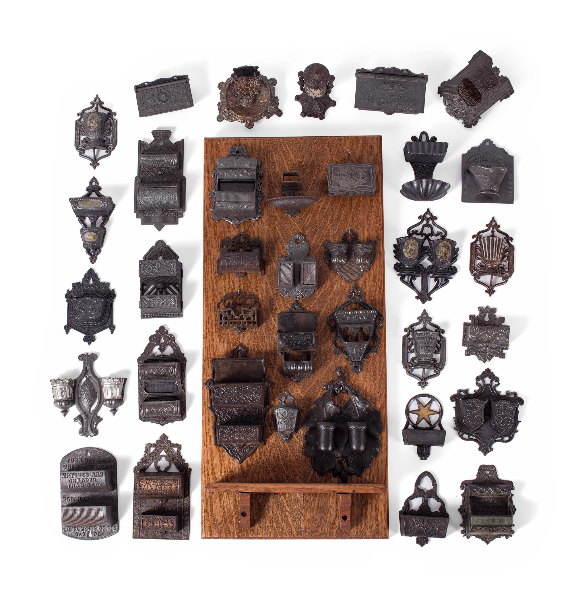 A Group of Cast Iron Hanging Match Holders
