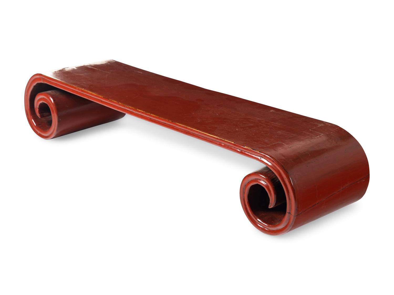 A Chinese Red Lacquered Low Scrolled-Form Low Table, Qinzhuo