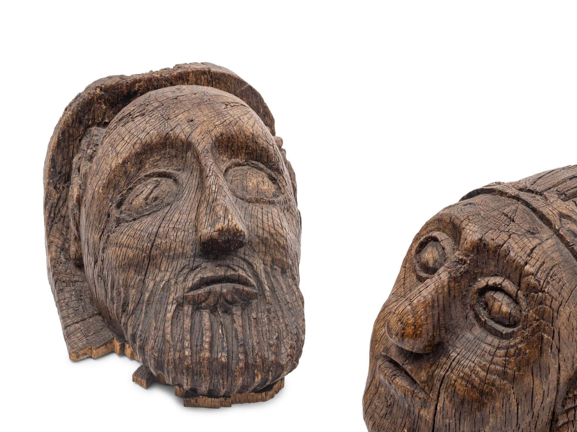 A Pair of Scottish Gothic Carved Oak Heads