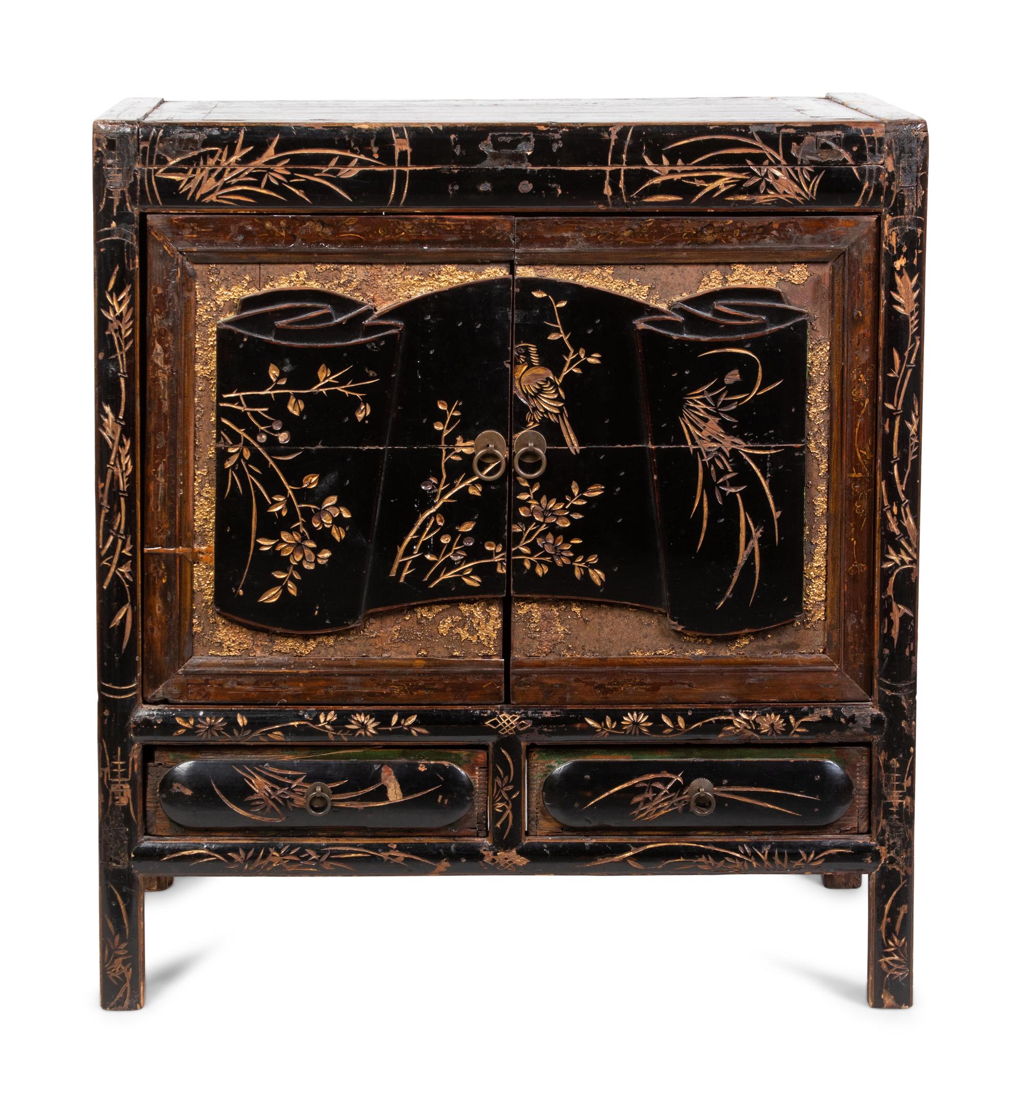 A Chinese Export Cabinet with Carved Lacquer Decoration