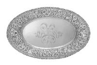 An American Silver Bread Dish, Baltimore Sterling Silver Co., Baltimore, MD, having a foliate and volute decorated rim, the border work
