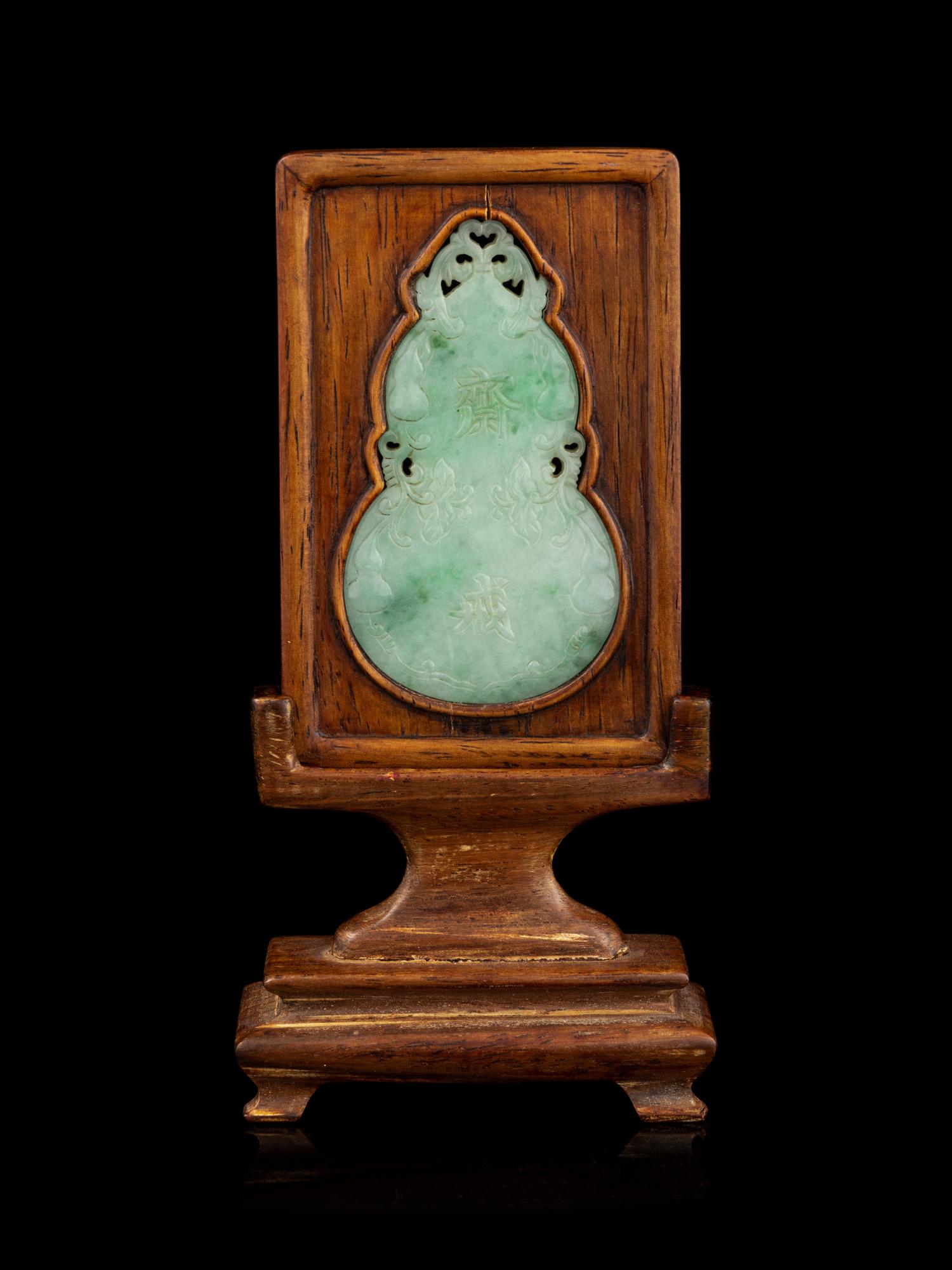 An Apple Green and Pale Celadon Jadeite Inset Hardwood Table Screen
