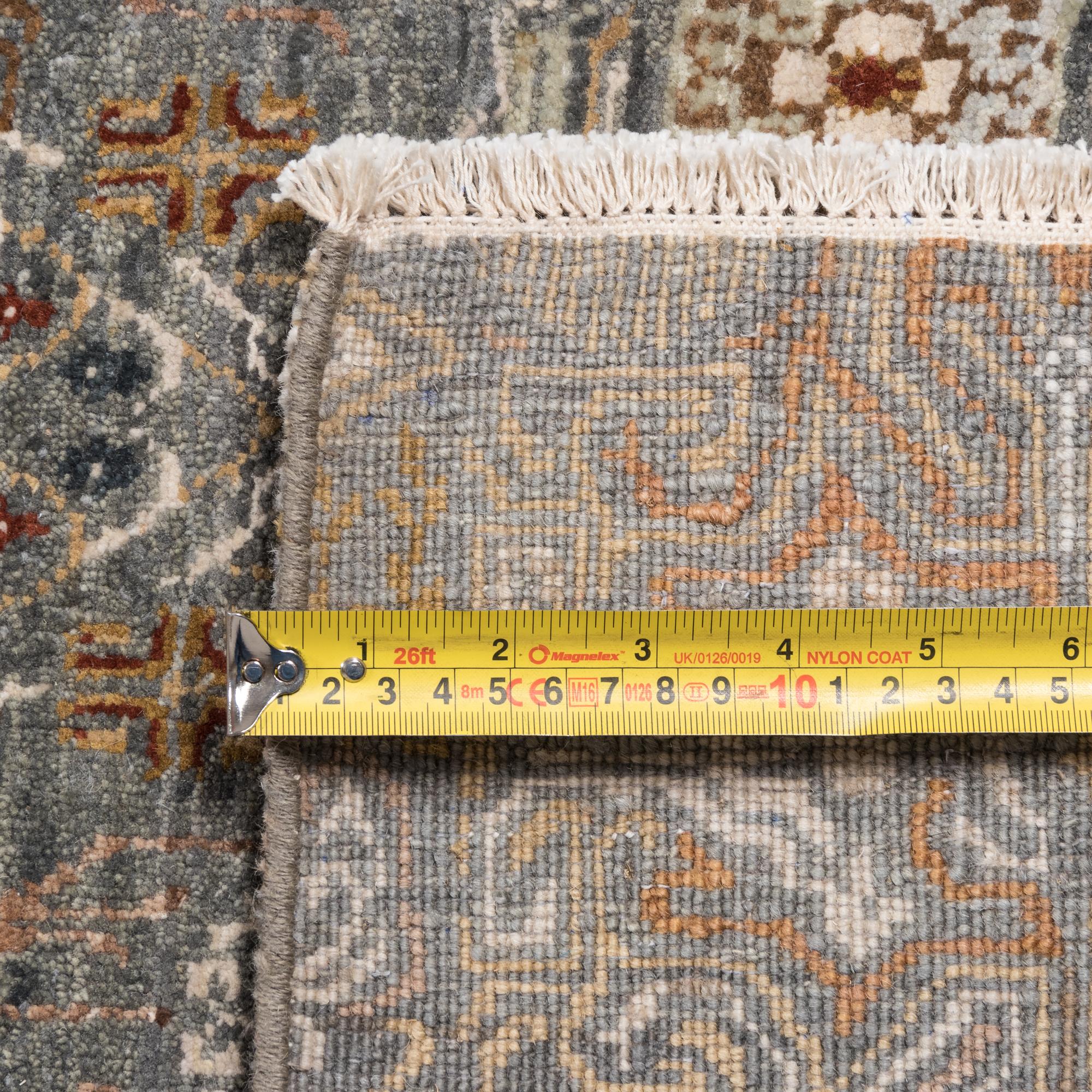 A Contemporary Fireplace-Fitted Wool Rug