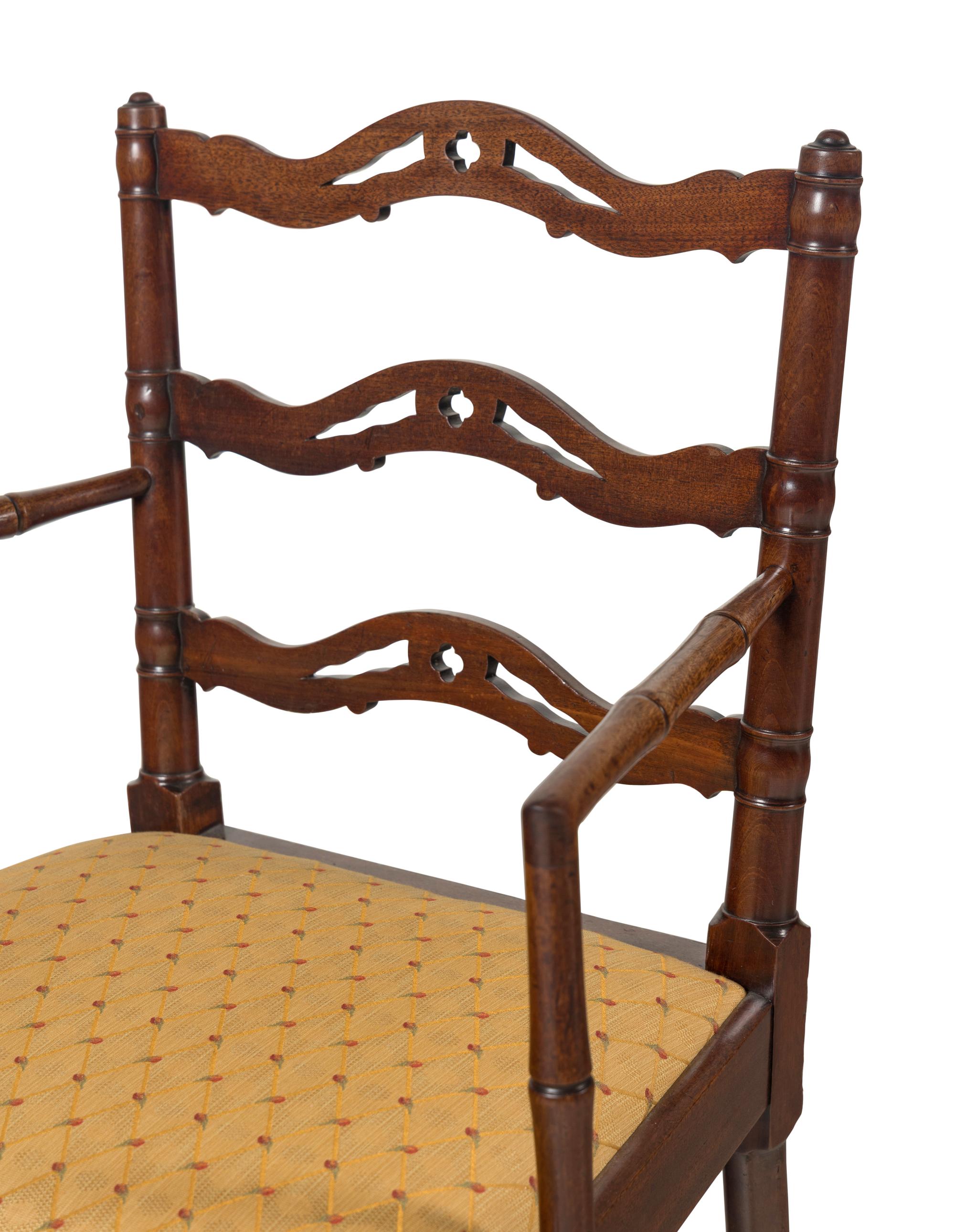 A Set of Four English Mahogany Faux-Bamboo Arm Chairs