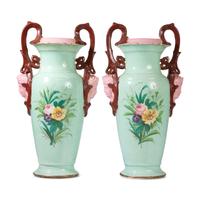 A Pair of Continental Porcelain Urns with Hand Painted and Transfer Decoration