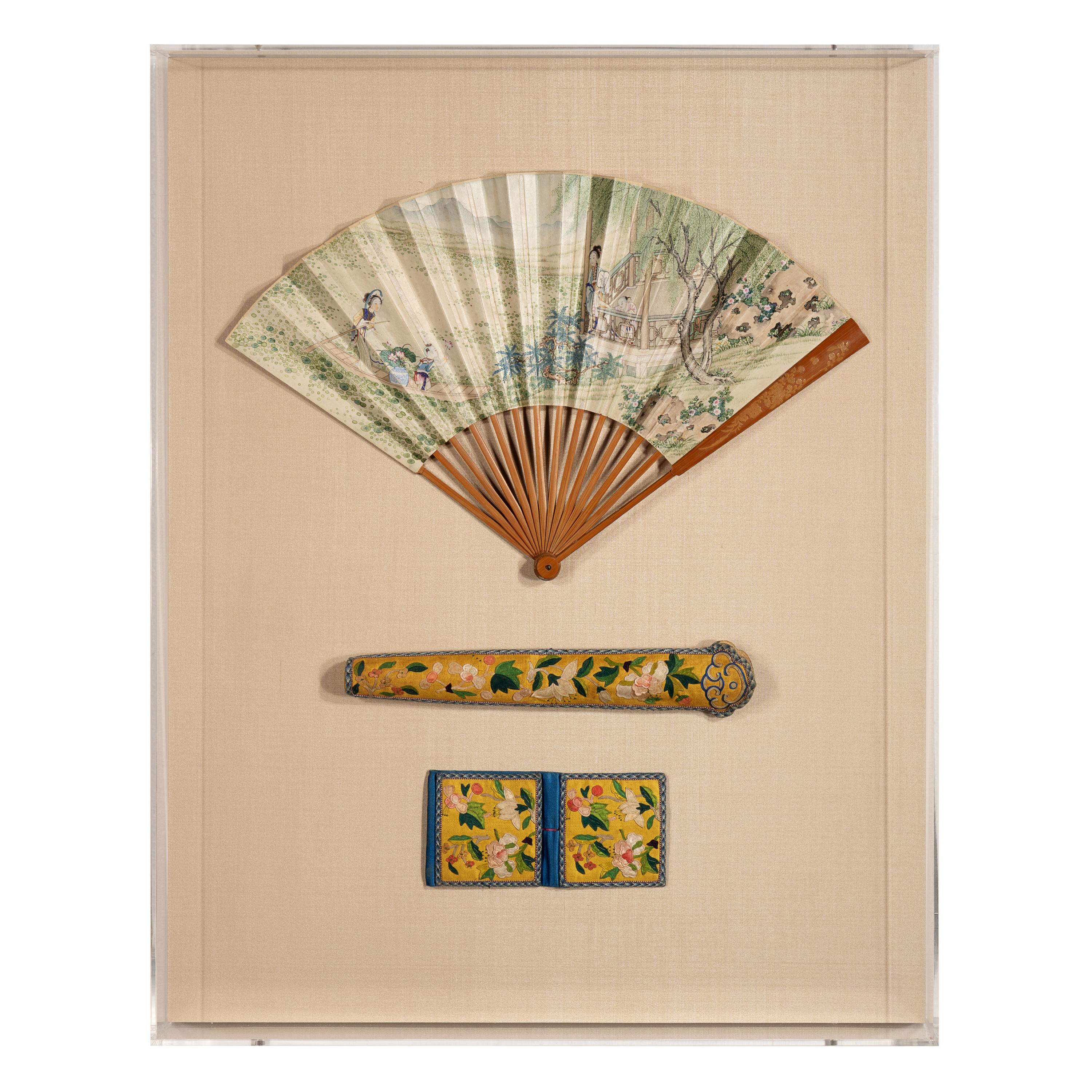 A Chinese Painted Folding Fan and Two Silk-Embroidered Accessories, 19th Century — 清晚期 紙本設色采蓮圖摺扇及黃地綉花扇套、錢包一套