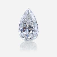 A diamond, colored diamond, and ten karat white gold pendant
