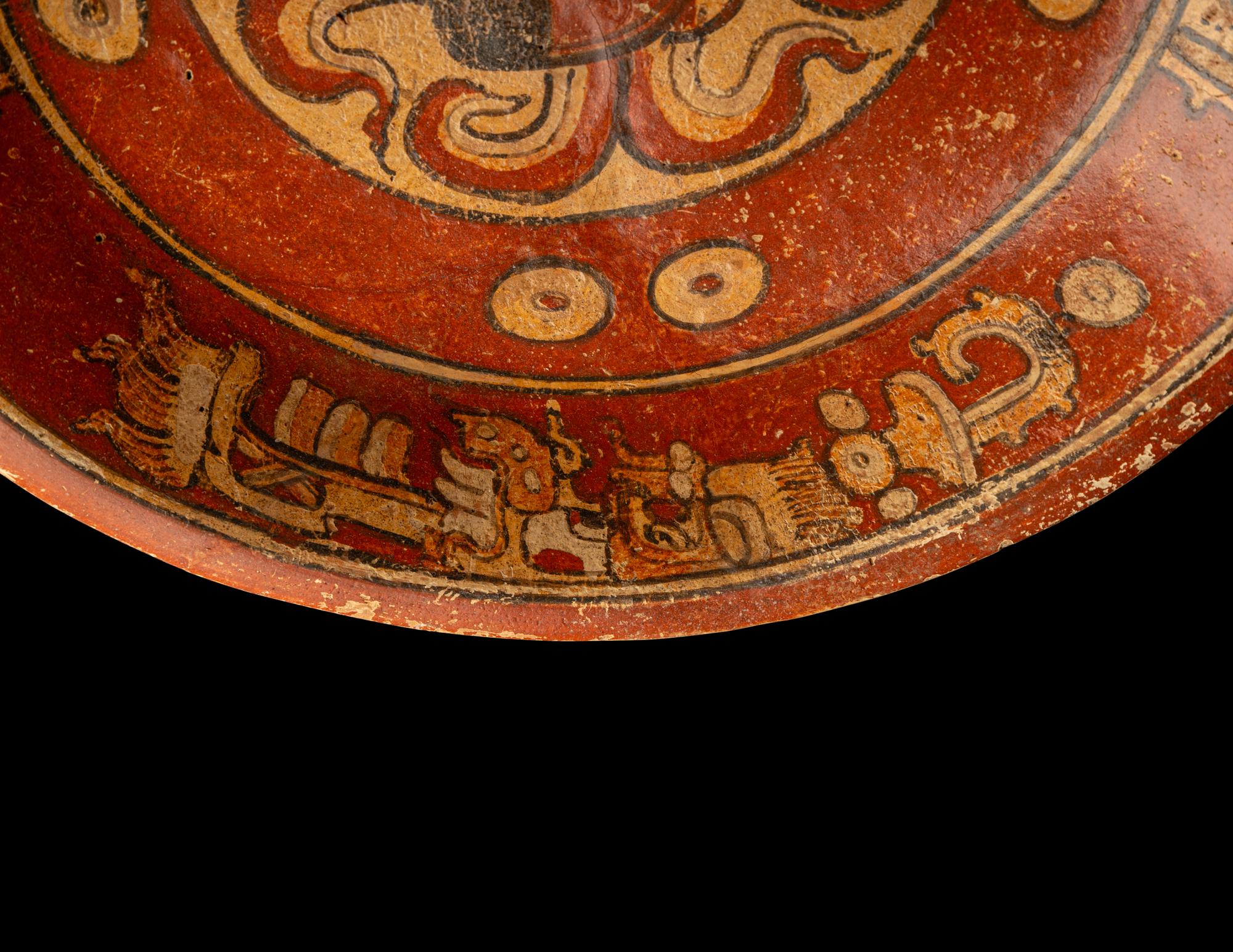 A Maya Polychrome Terracotta Tripod Plate with Gods and Glyphs
