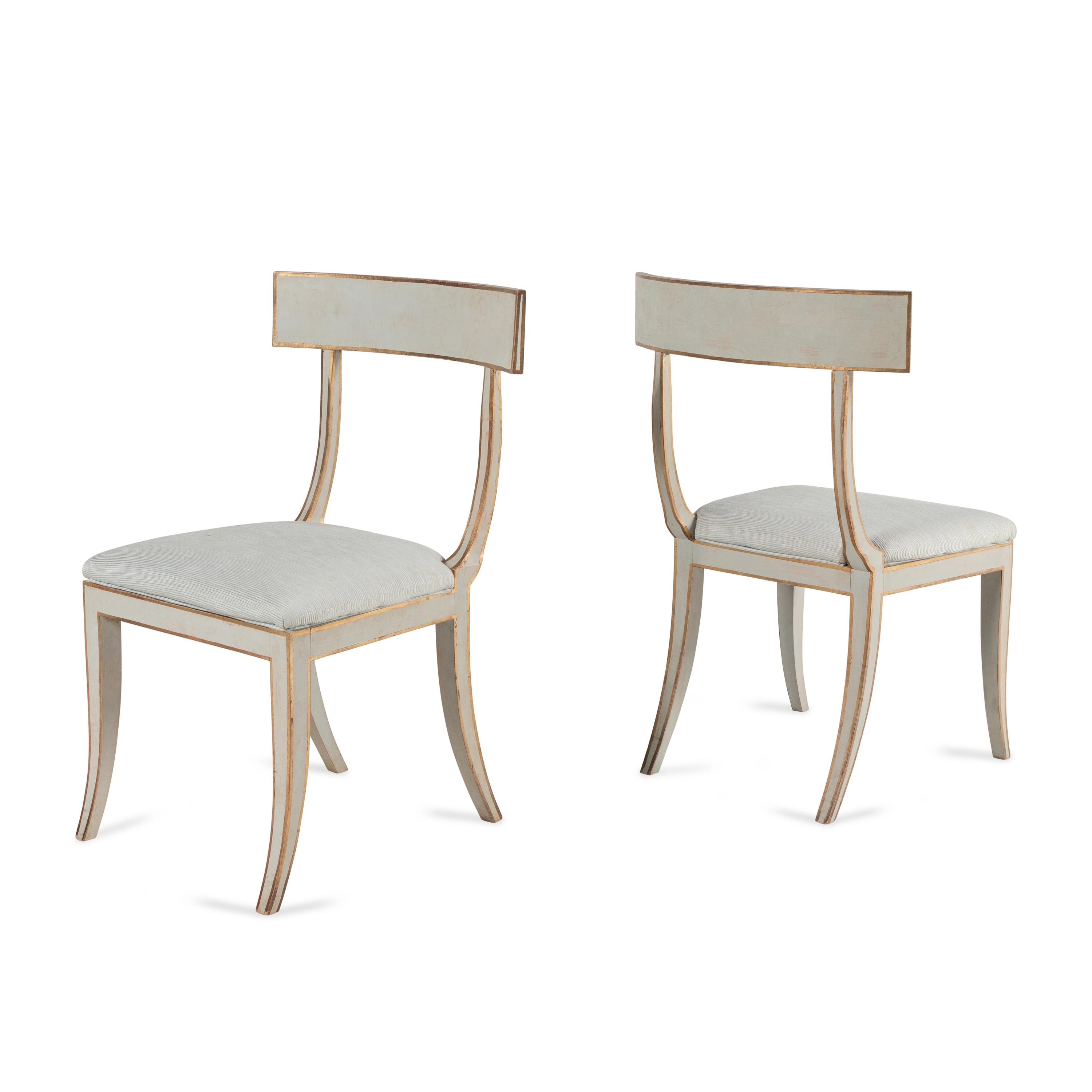 A Group of Six Light Blue-Painted and Parcel-Gilt Klismos Dining Chairs
