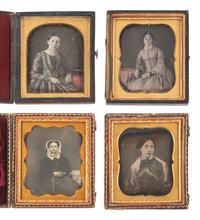 [EARLY PHOTOGRAPHY]. 20 daguerreotypes feat. women with gold accessories incl. example by PLUMBE.