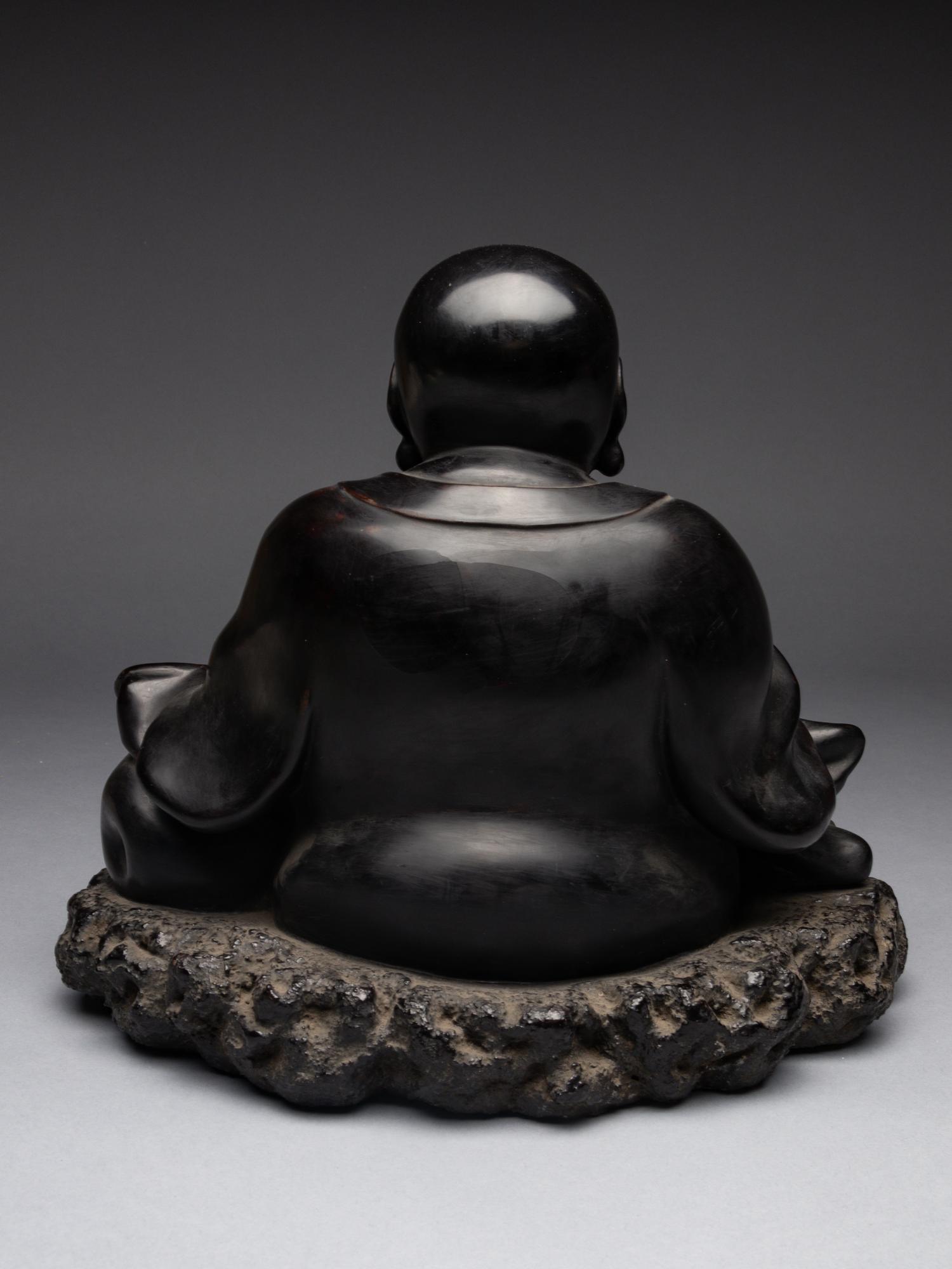 A Black Lacquered 'Jiazhu' Figure of Budai Buddha
