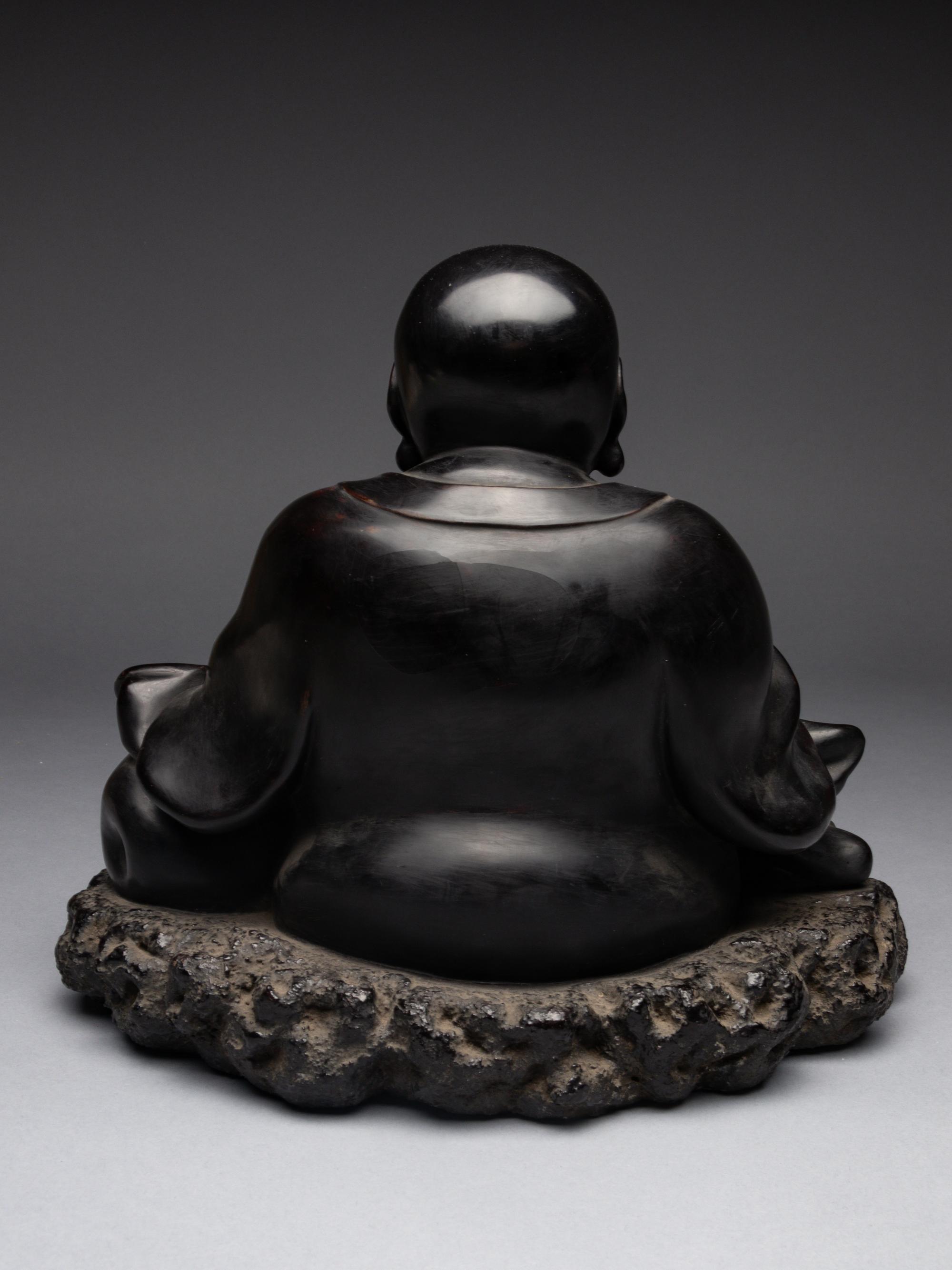 A Black Lacquered 'Jiazhu' Figure of Budai Buddha