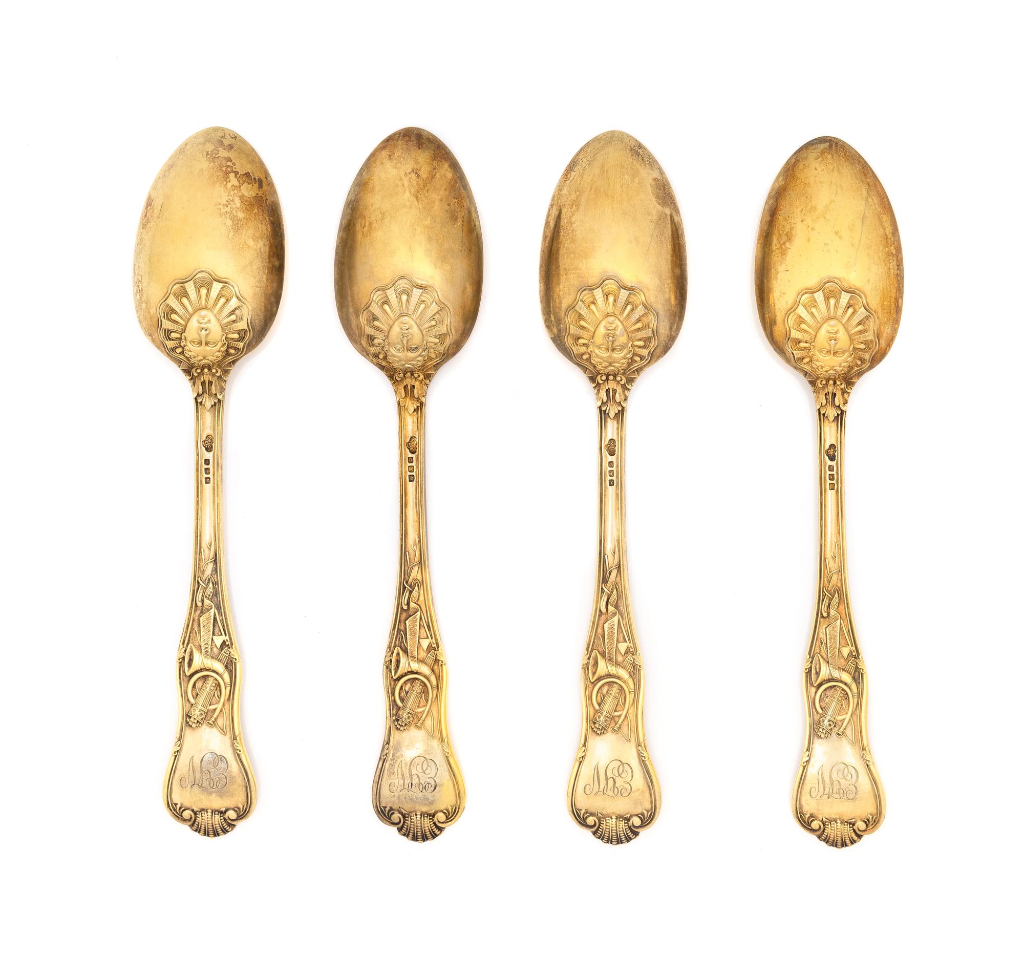 A Set of Four English Silver-Gilt Dessert Spoons