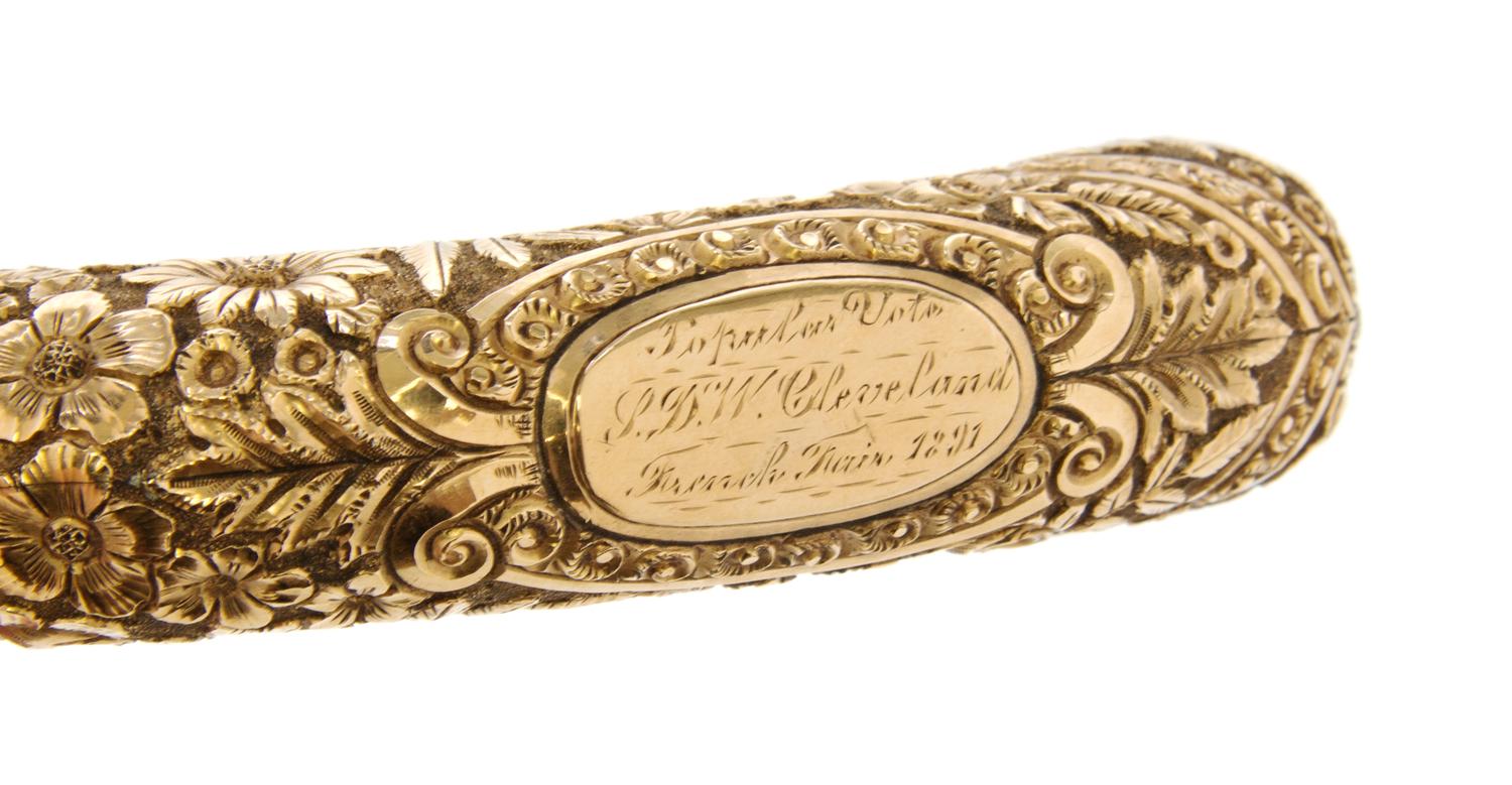 An American Presentation 14 Karat Gold Handled Cane, Length of handle 5 x length overall 34 inches.