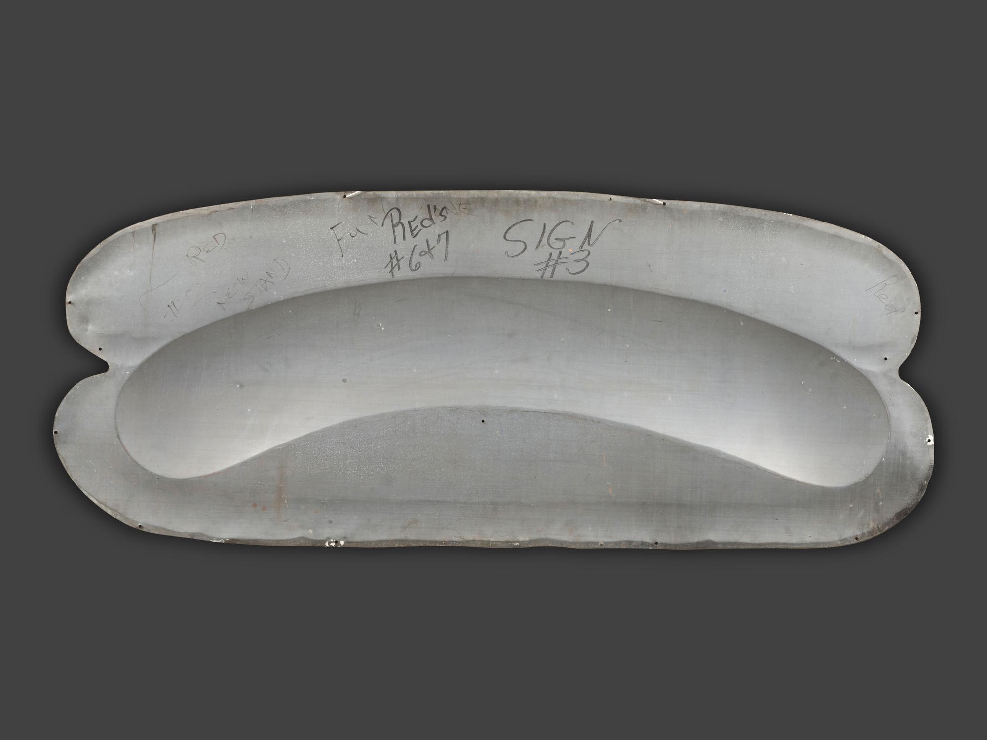 A Coca-Cola Embossed Tin Hot Dog Sign