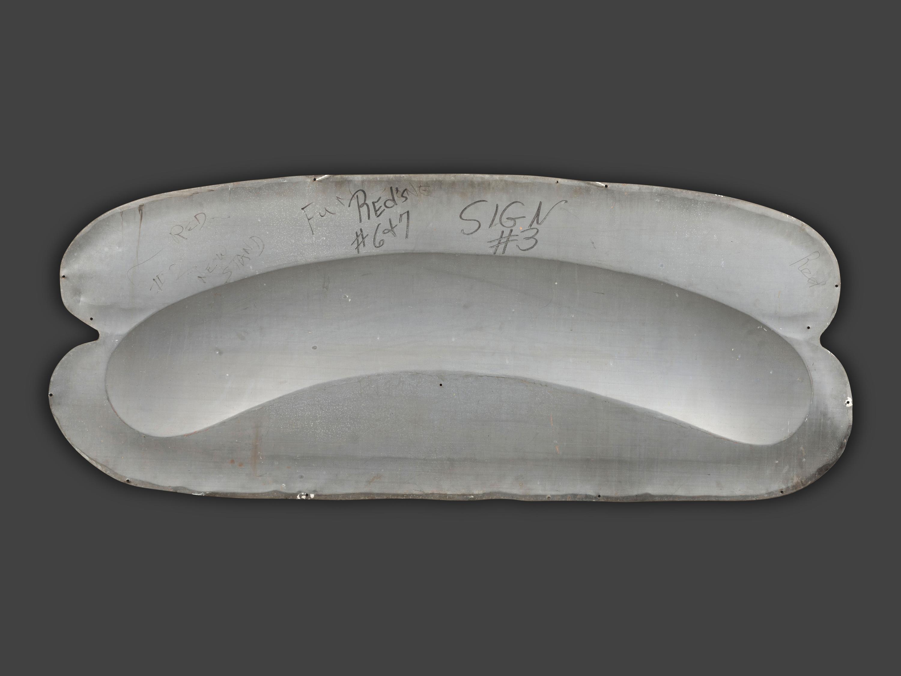 A Coca-Cola Embossed Tin Hot Dog Sign