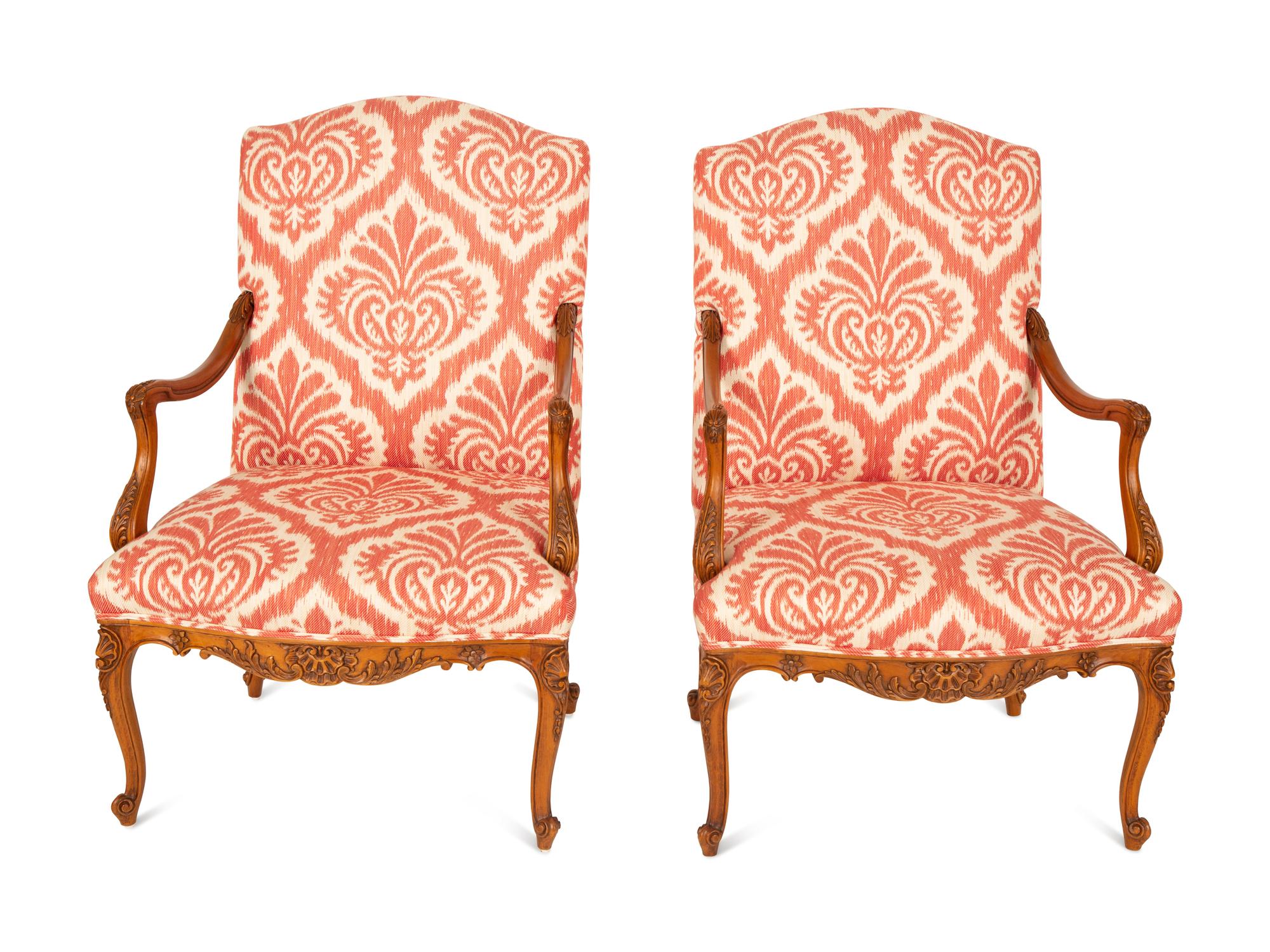 A Pair of Régence Style Walnut Fauteuils