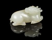 A White Jade Figure of a Deer Length 2 1/4 inches. — 18TH/19TH CENTURY