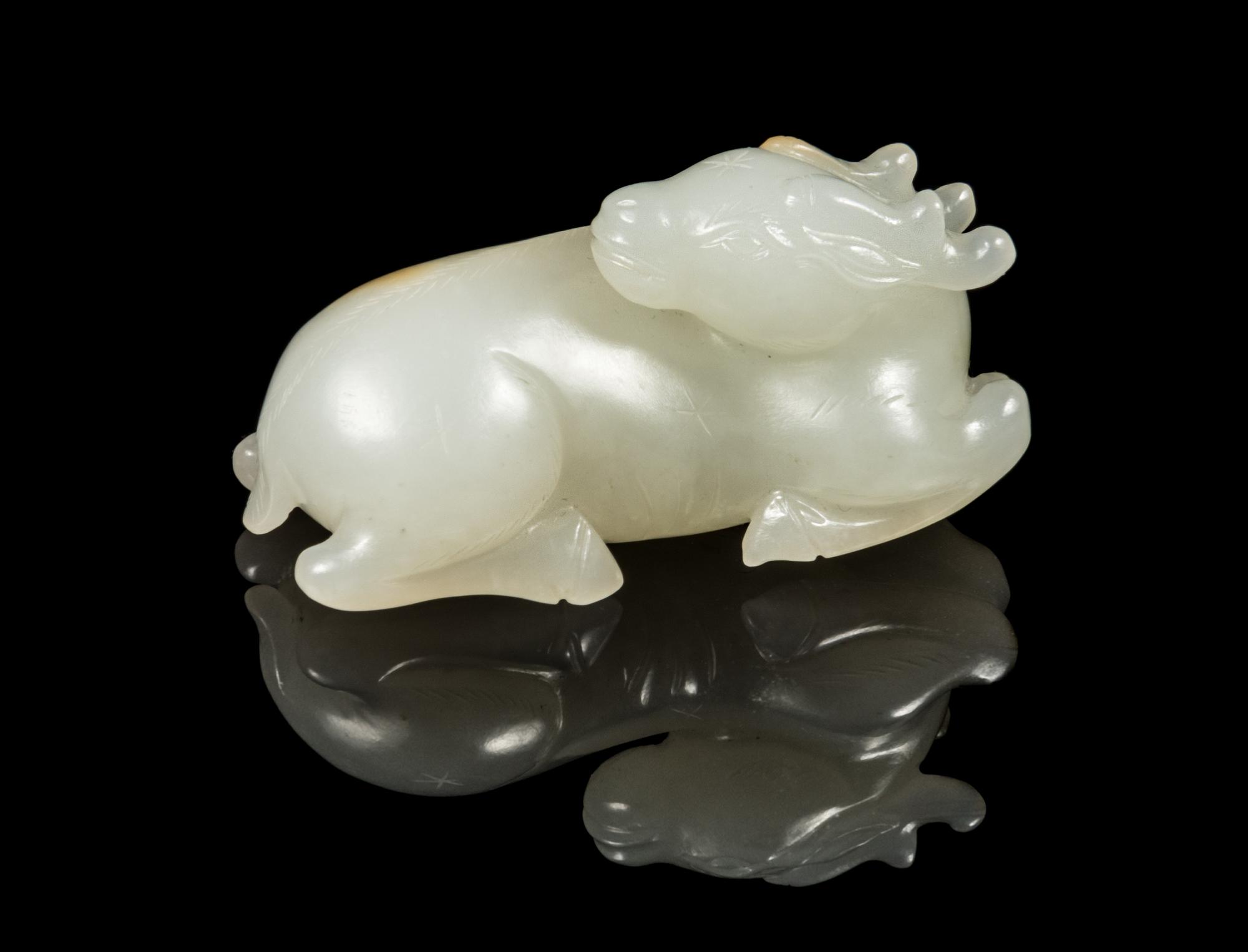 A White Jade Figure of a Deer Length 2 1/4 inches. — 18TH/19TH CENTURY
