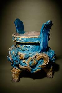 A Turquoise and Ochre Glazed Tileworks Tripod Incense Burner