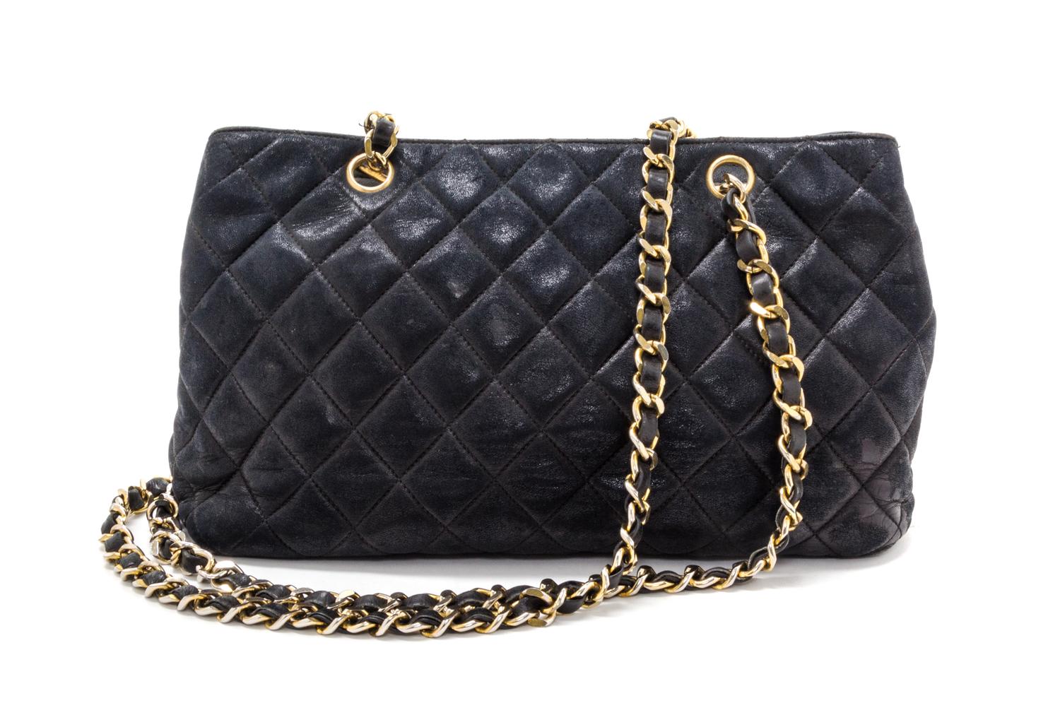 A Chanel Black Distressed Leather Quilted Handbag, 12" x 8" x 4".