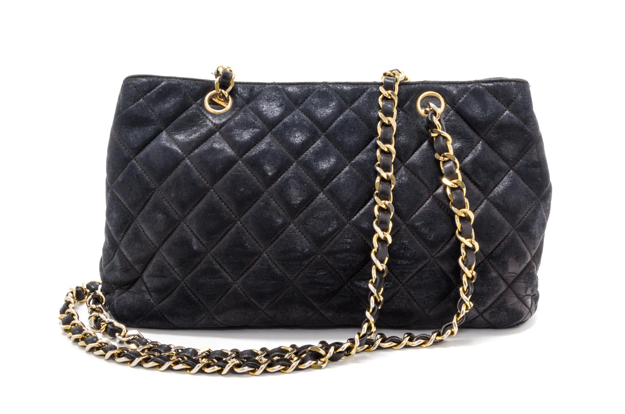 A Chanel Black Distressed Leather Quilted Handbag, 12" x 8" x 4".