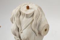 An Italian Carved White Marble Female Torso on an Iron Base