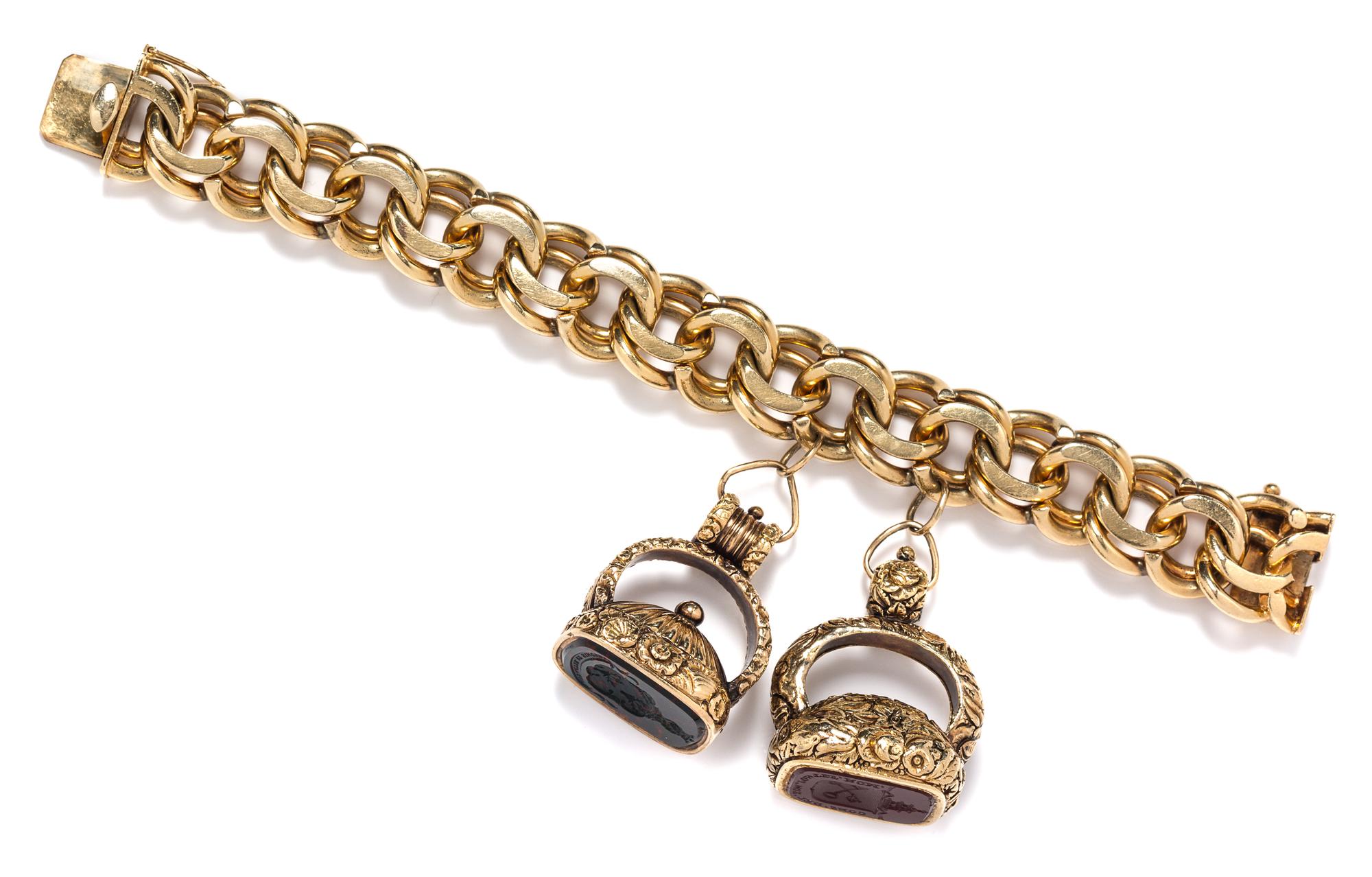 A Yellow Gold Link Bracelet with Two Attached Hardstone Intaglio Fobs, 133.00 dwts.
