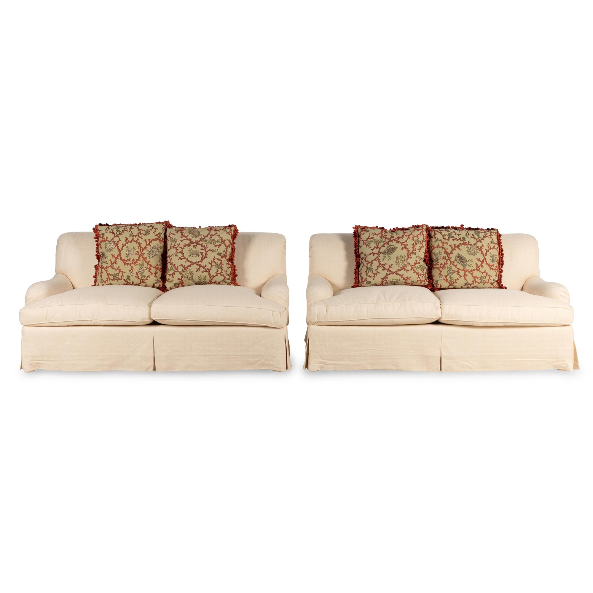 A Pair of Linen-Upholstered Two-Cushion Sofas with Custom Throw Pillows