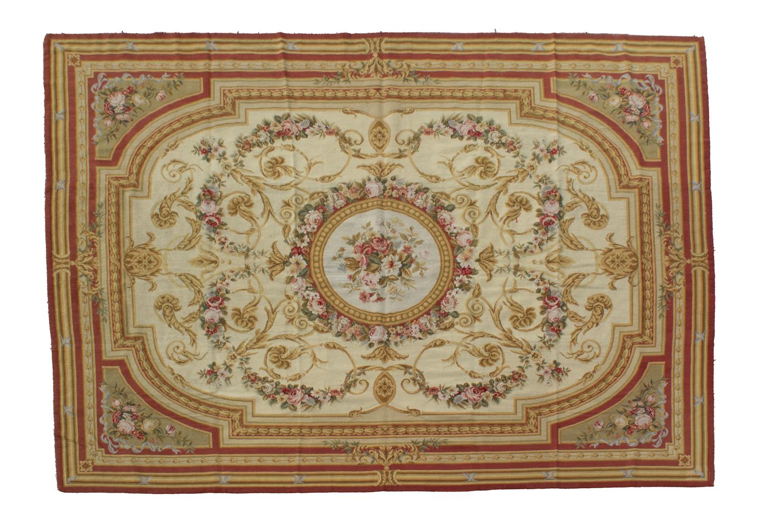 An Aubusson Style Needlepoint Rug 9 feet 8 inches x 7 feet 1 inch. — 20TH CENTURY