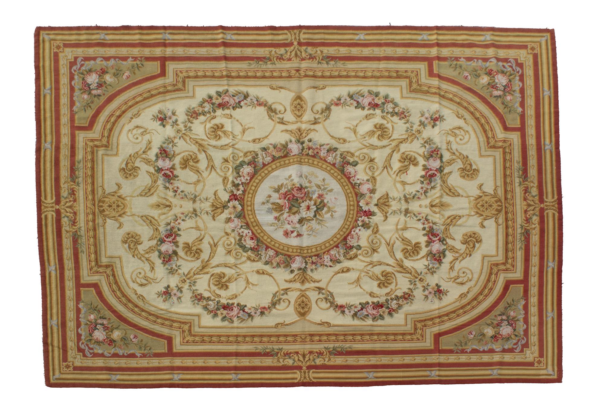 An Aubusson Style Needlepoint Rug 9 feet 8 inches x 7 feet 1 inch. — 20TH CENTURY
