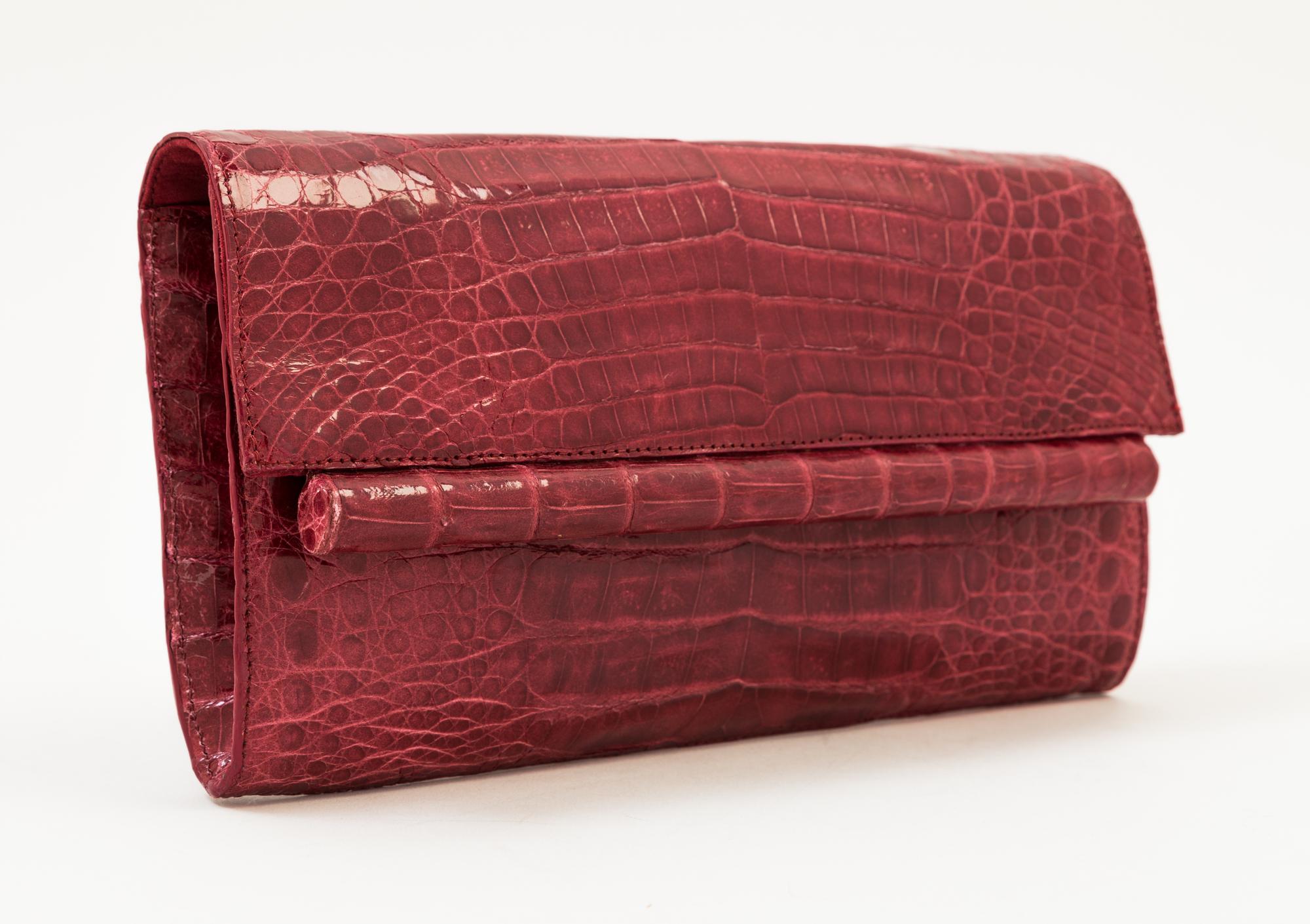 A Nancy Gonzalez Burgundy Columbian Crocodile Clutch, 8.75" x 4.75" x 1.25".