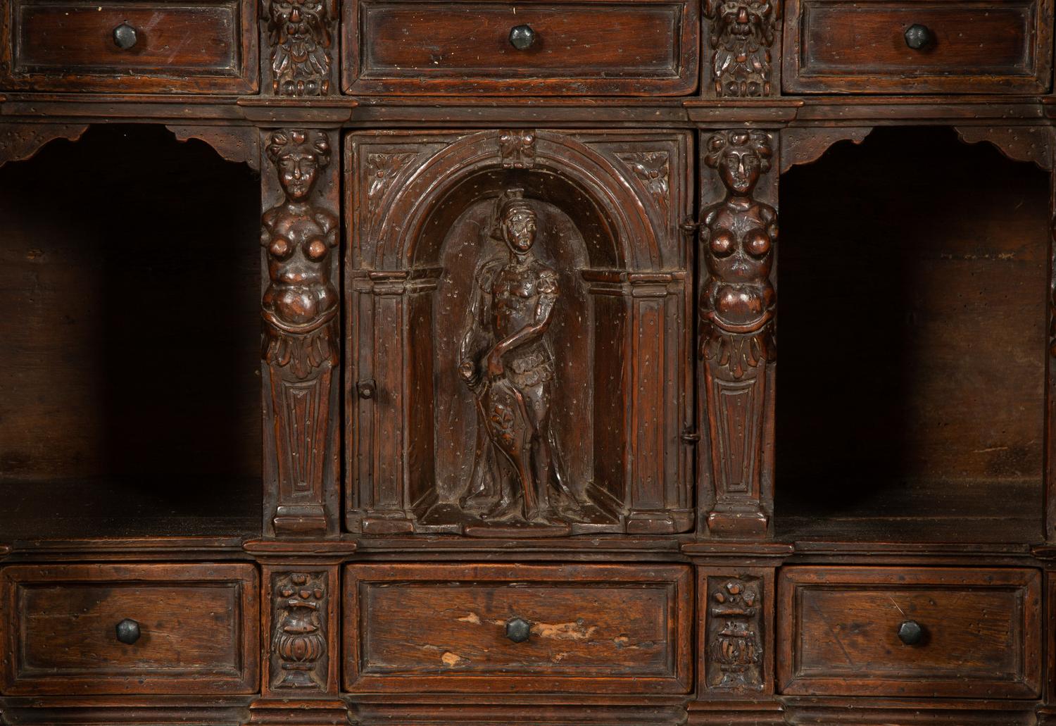 An Italian Carved Walnut Cabinet on Stand