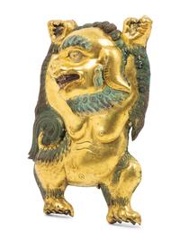 A Sino-Tibetan Gilt Bronze Repoussé Fu-Lion